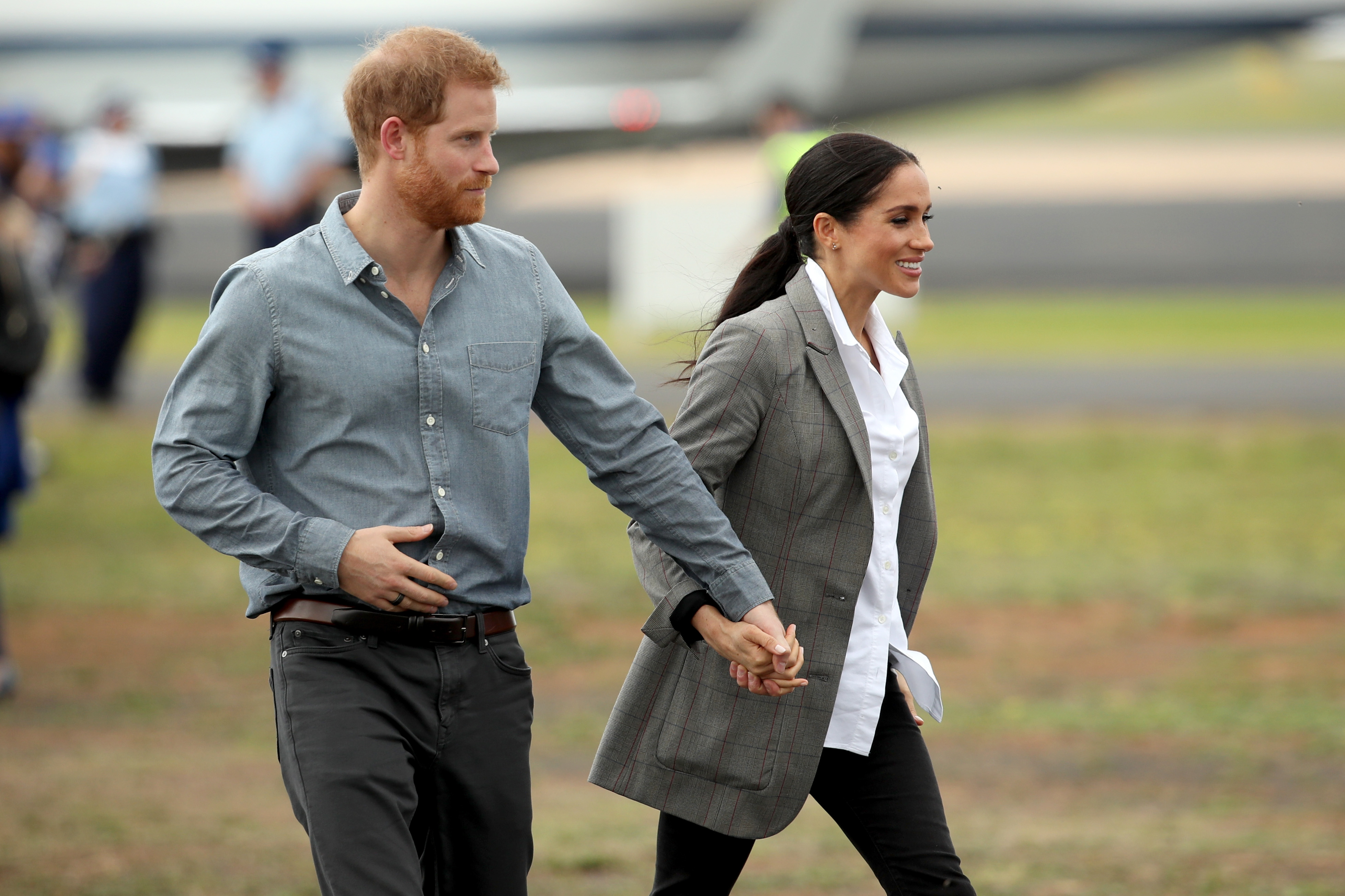 Prince Harry and Meghan Markle arrive at Dubbo Airport in Australia on October 17, 2018, during an official royal tour. Their August 2026 arrival in Britain came under very different circumstances, as they returned with their children to establish a private family life in the U.K. | Source: Getty Images