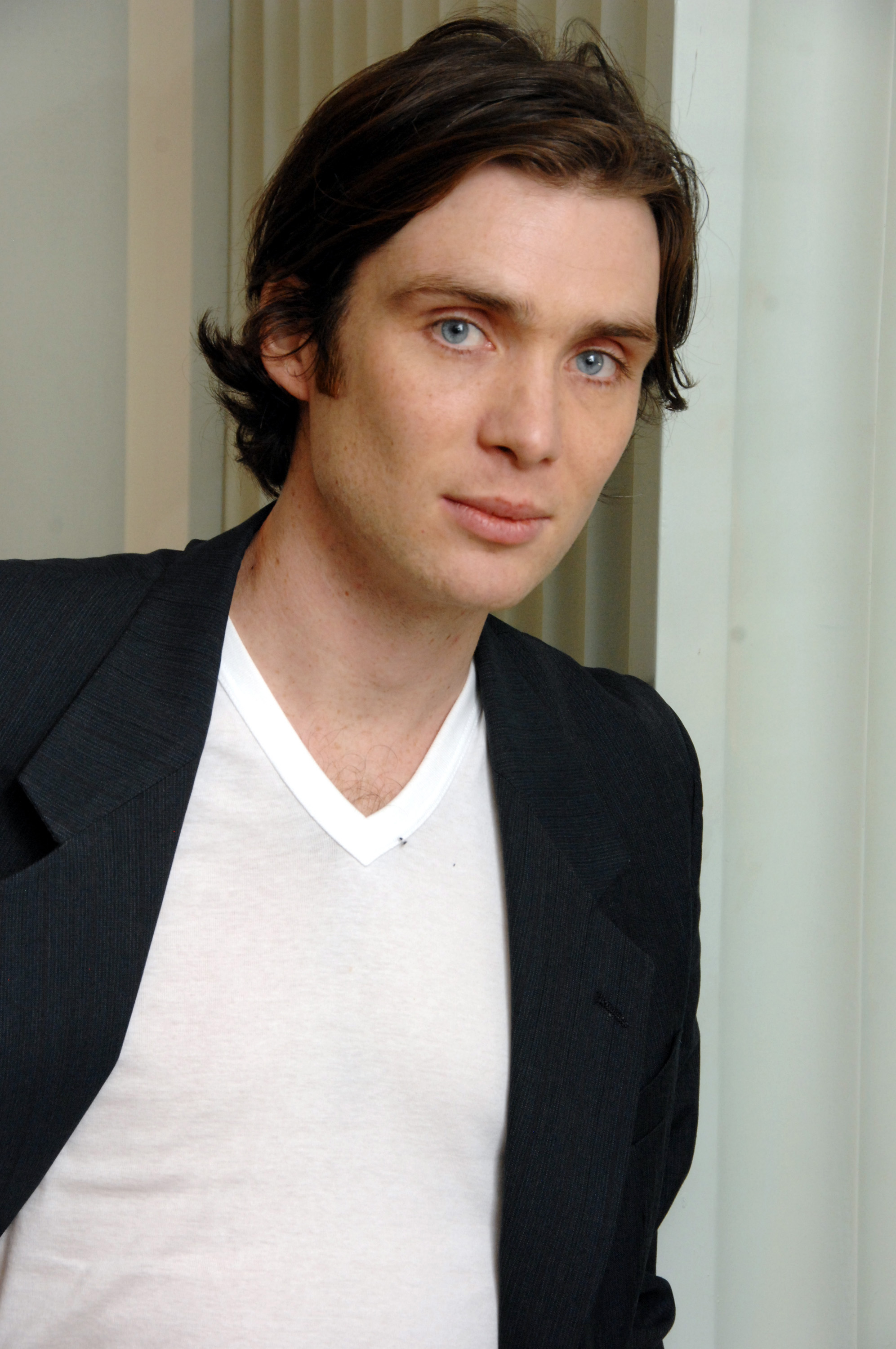 Cillian Murphy posed for a portrait during the "Sunshine" press conference at Casa del Mar in Santa Monica, California, on February 28, 2007, while promoting the science fiction drama. The portrait highlighted the actor's youthful appearance, distinctive blue eyes, and understated style as he continued a busy day of interviews and publicity appearances.