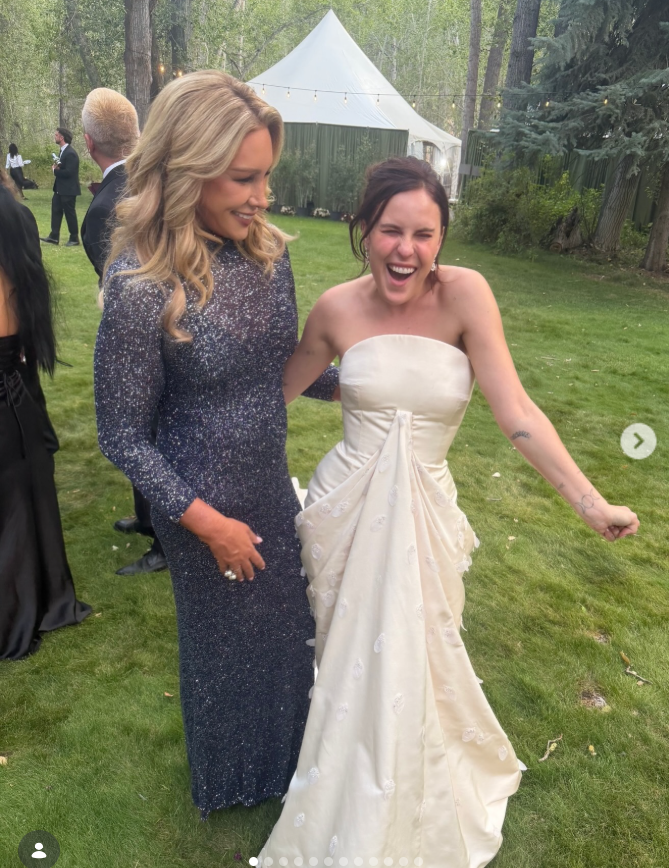 Tallulah Willis is pictured laughing alongside Heather Parry at the wedding celebration, her strapless gown creating a striking silhouette as she enjoys the moment. The image captures the confidence behind Tallulah’s reflection that she had worked hard to feel “comfortable in my own skin” — before the spotlight turned to the very different fashion choice made by her mother, Demi Moore. | Source: Instagram/heather_parry