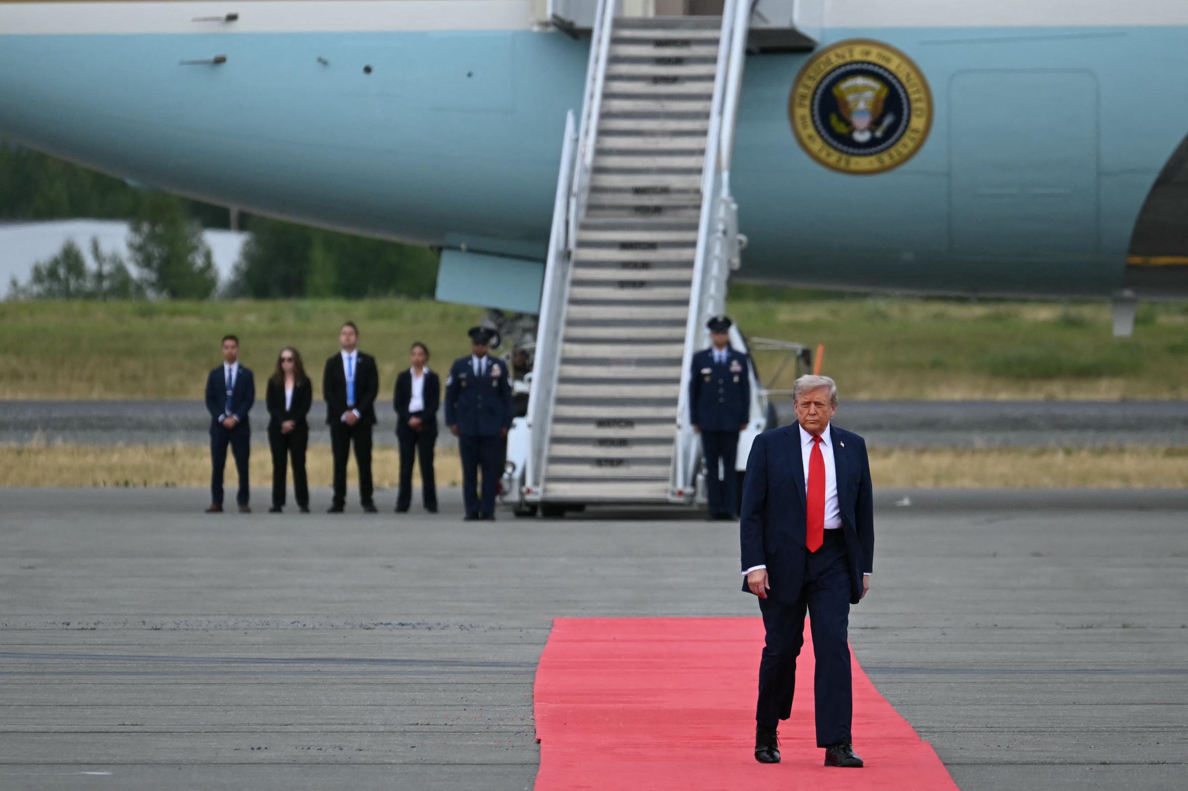 Donald Trump walks on the red carpet before greeting Vladimir Putin at Joint Base Elmendorf-Richardson in Anchorage, Alaska, on August 15, 2025 | Source: Getty Images