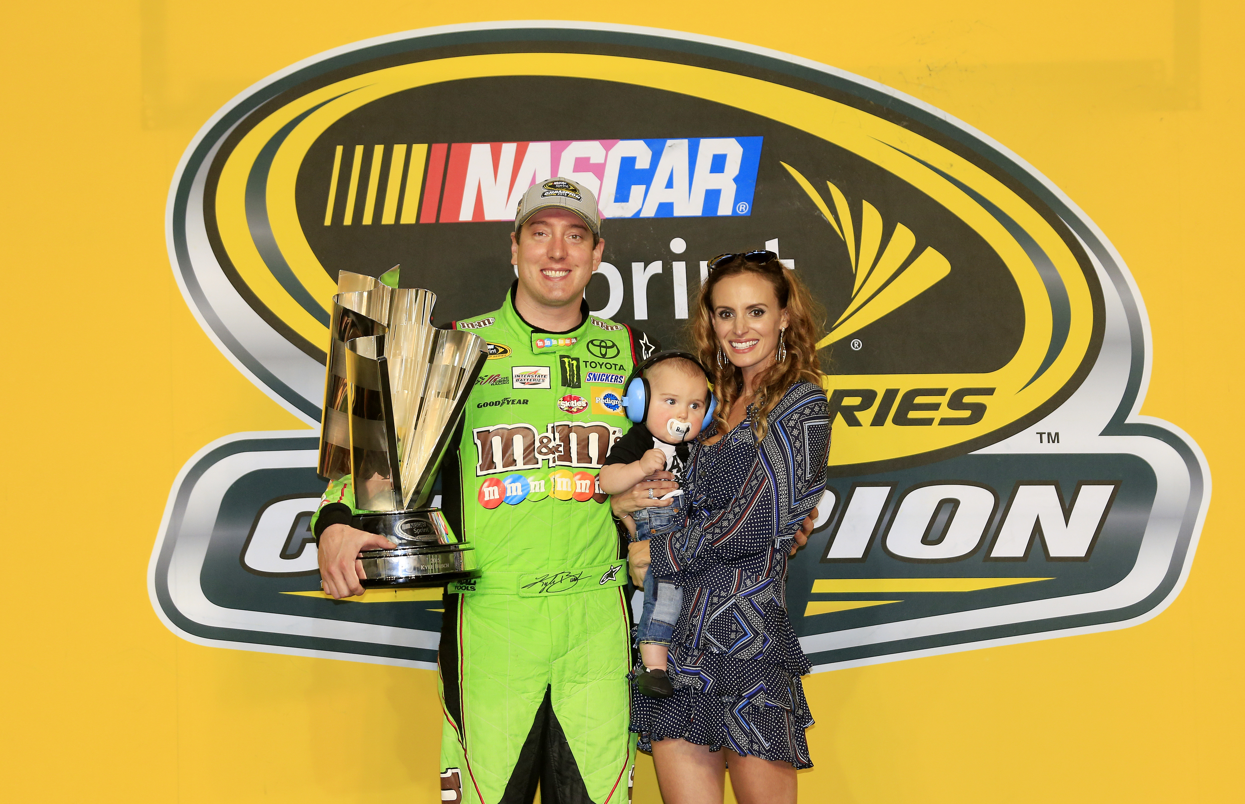 Kyle, Samantha, and Brexton Busch after Kyle won at the NASCAR Sprint Cup Series Ford EcoBoost 400 in Homestead, Florida on November 22, 2015. | Source: Getty Images