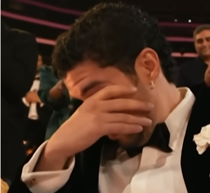 Bad Bunny reacts to winning Album of the Year for "DeBÍ TiRAR MáS FOToS" during the 68th Annual Grammy Awards at Crypto.com Arena on February 1, 2026, in Los Angeles | Source: YouTube/enews