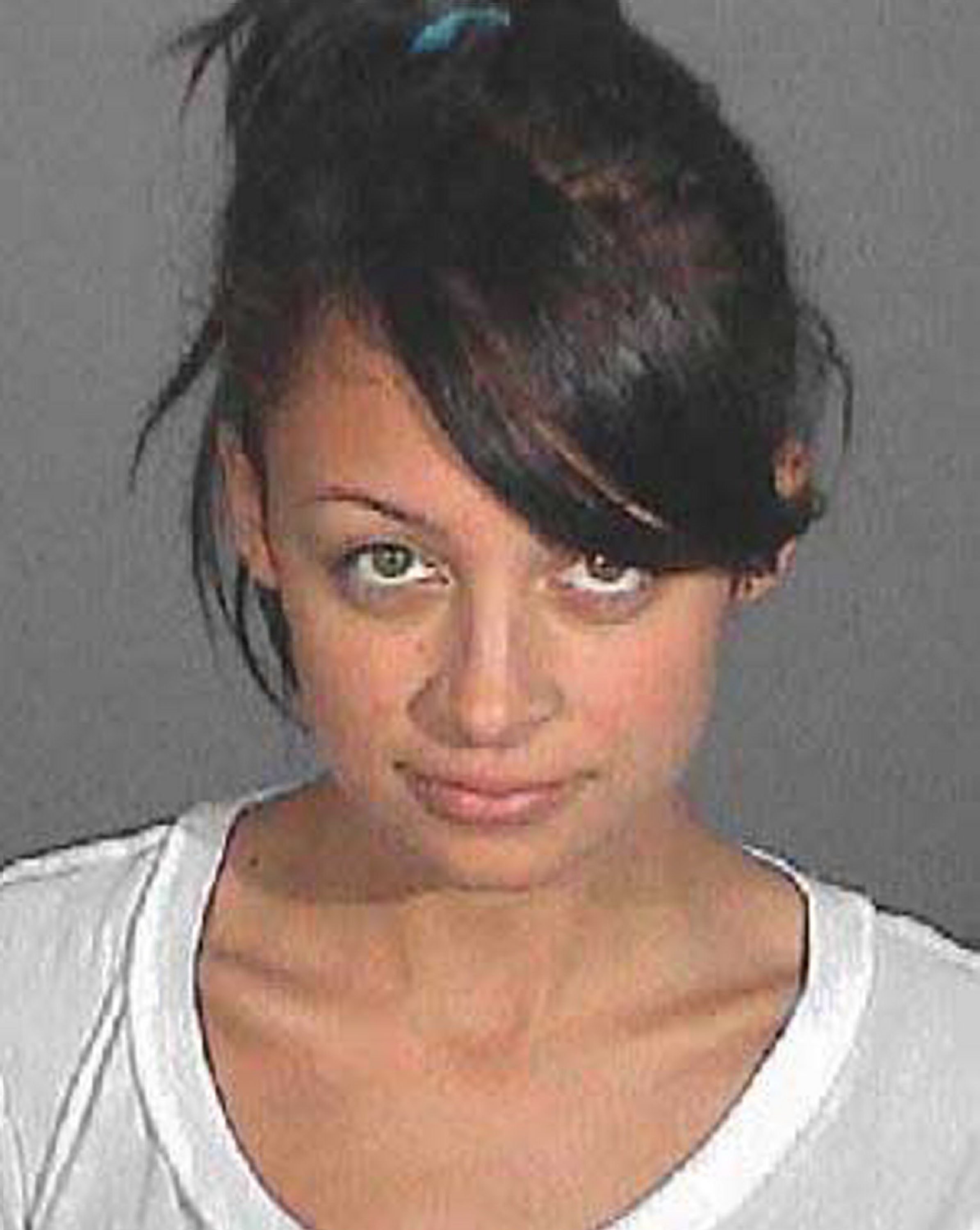 Nicole Richie posing for her mugshot in Glendale, California on December 11, 2006. | Source: Getty Images