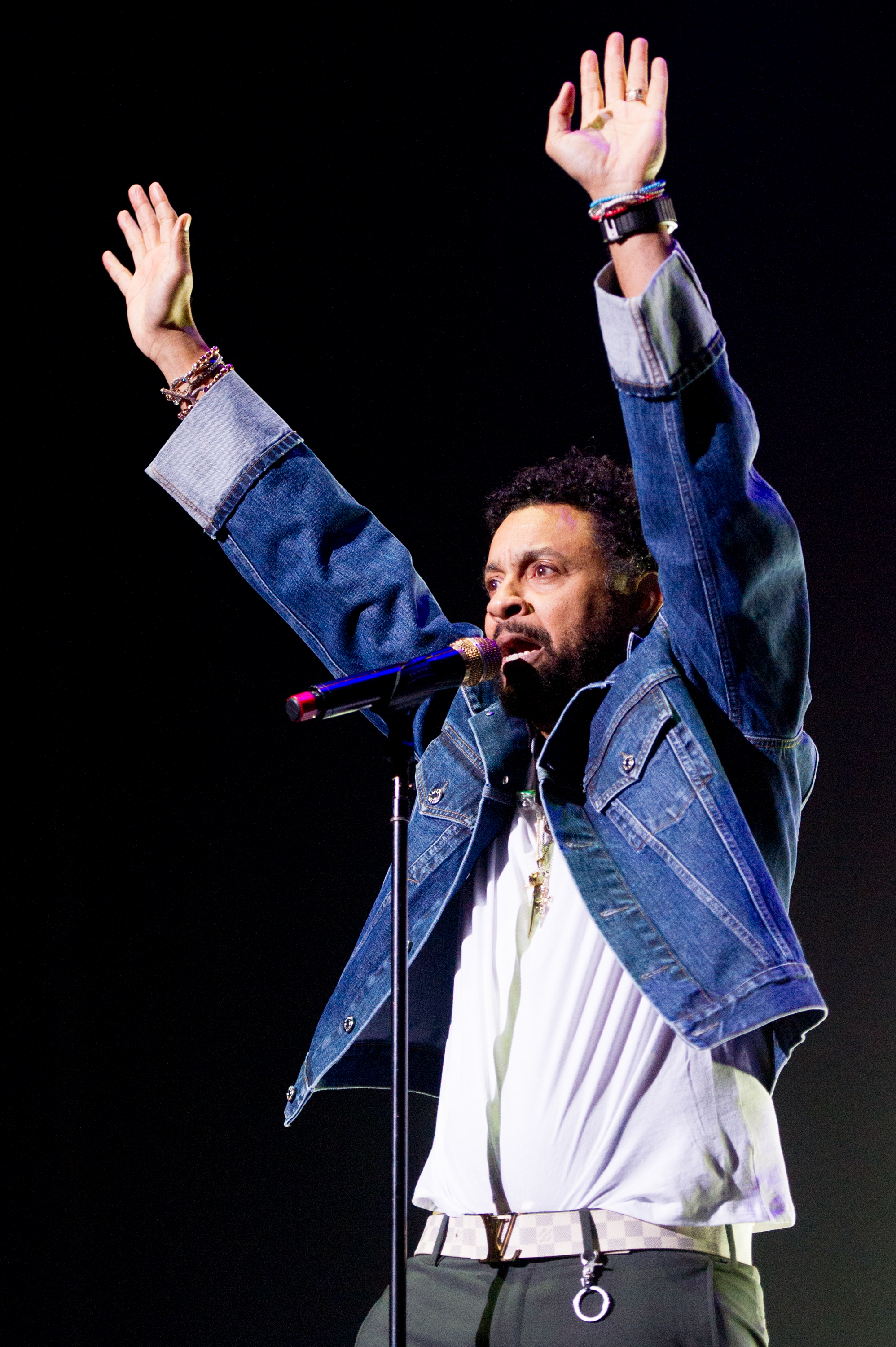 Shaggy raises his hands while performing onstage during KISSTORY: The Blast Off Tour in London, England, on March 11, 2020 | Source: Getty Images