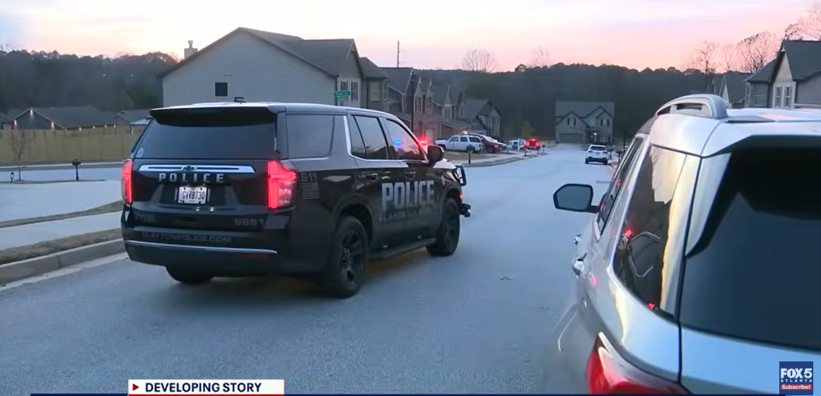 Police cars gathered outside the house where the tragedy happened, as seen from a video post dated December 4, 2025. | Source: YouTube/FOX5Atlanta