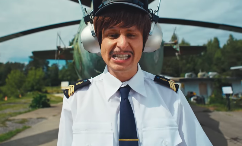 Tree's pilot imagery in "Flowers" originally fit his offbeat visual style, which often blurred comedy, character work, and surreal storytelling. After his reported death in a helicopter crash, viewers say those visuals feel painfully different. | Source: YouTube/Oliver Tree