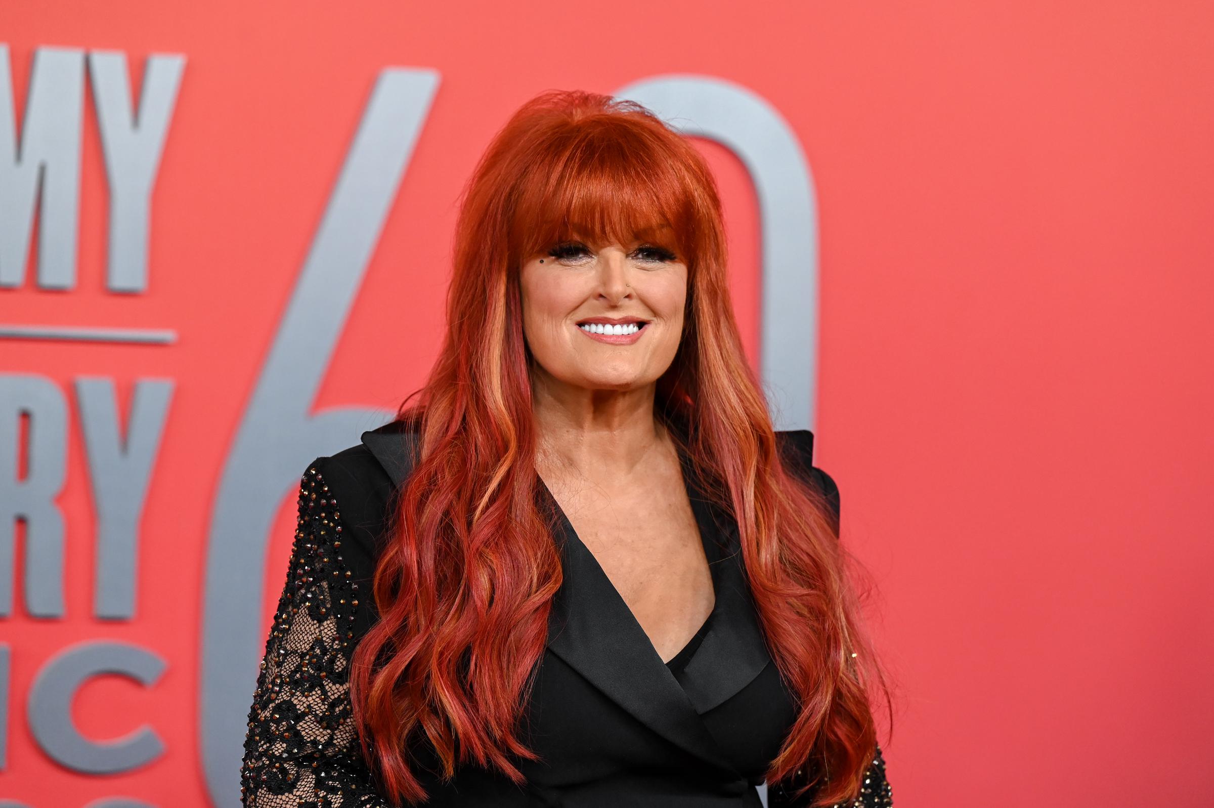 Later that day, Wynonna smiled for cameras at the Academy of Country Music Awards in Frisco, Texas. Framed from the waist up, the photo provides a different perspective on her changing appearance while keeping the focus on her face and upper body.