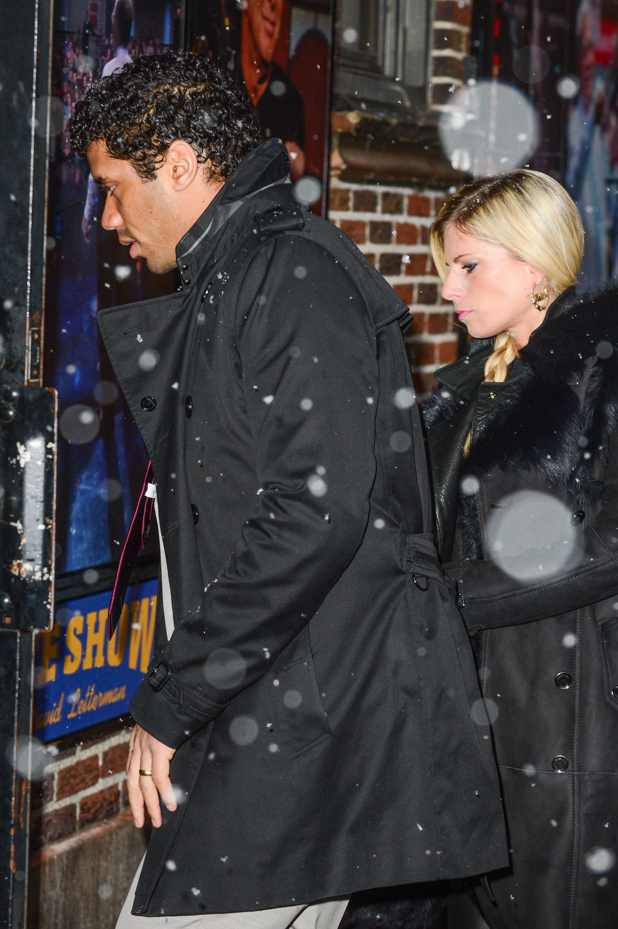 Russell Wilson and Ashton Meem enter the "Late Show With David Letterman" on February 3, 2014 in New York City | Source: Getty Images