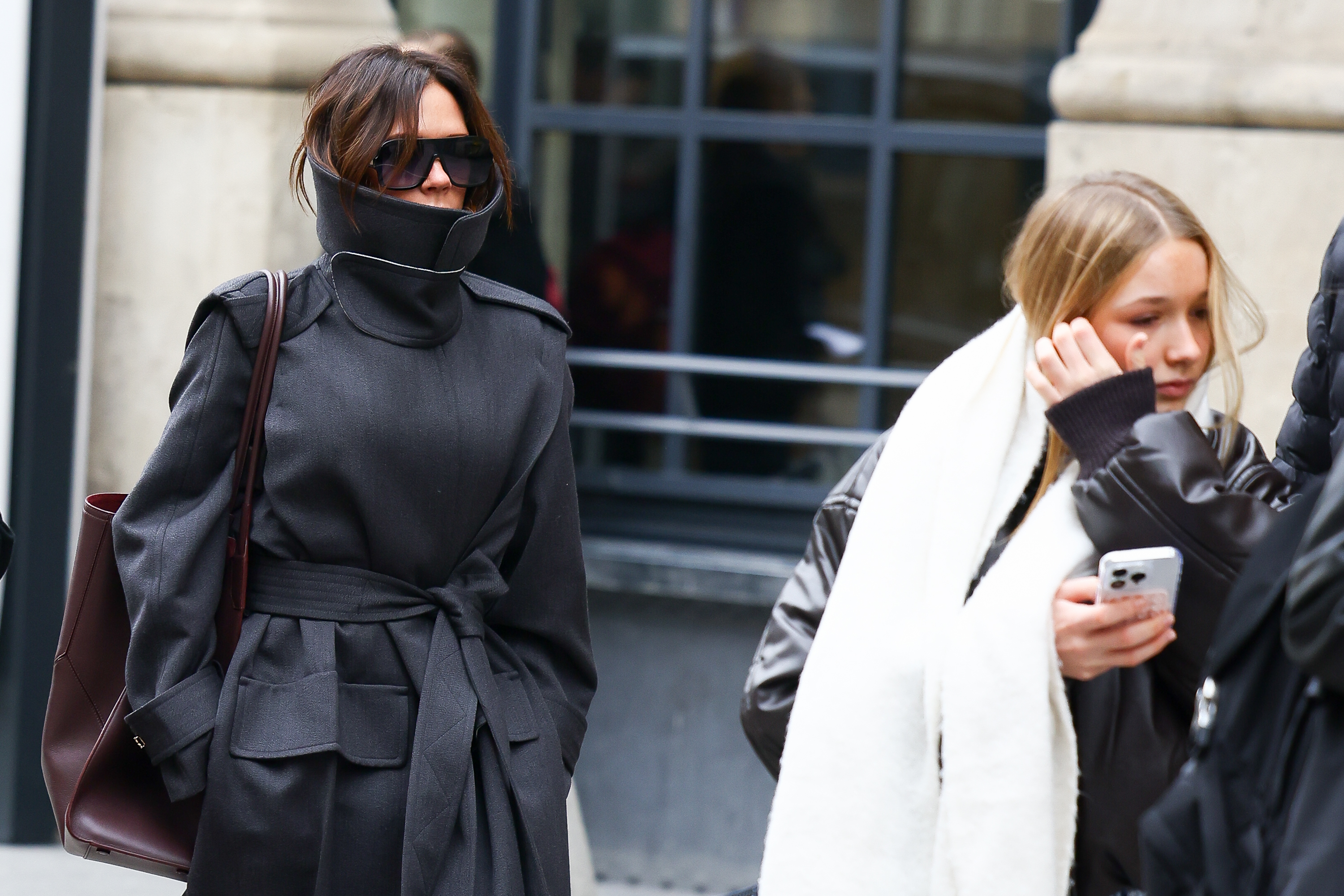 Victoria and Harper have long shown contrasting styles when photographed together. In Paris in November 2024, Victoria wore a structured dark coat while Harper kept her look more casual beside her. | Source: Getty Images