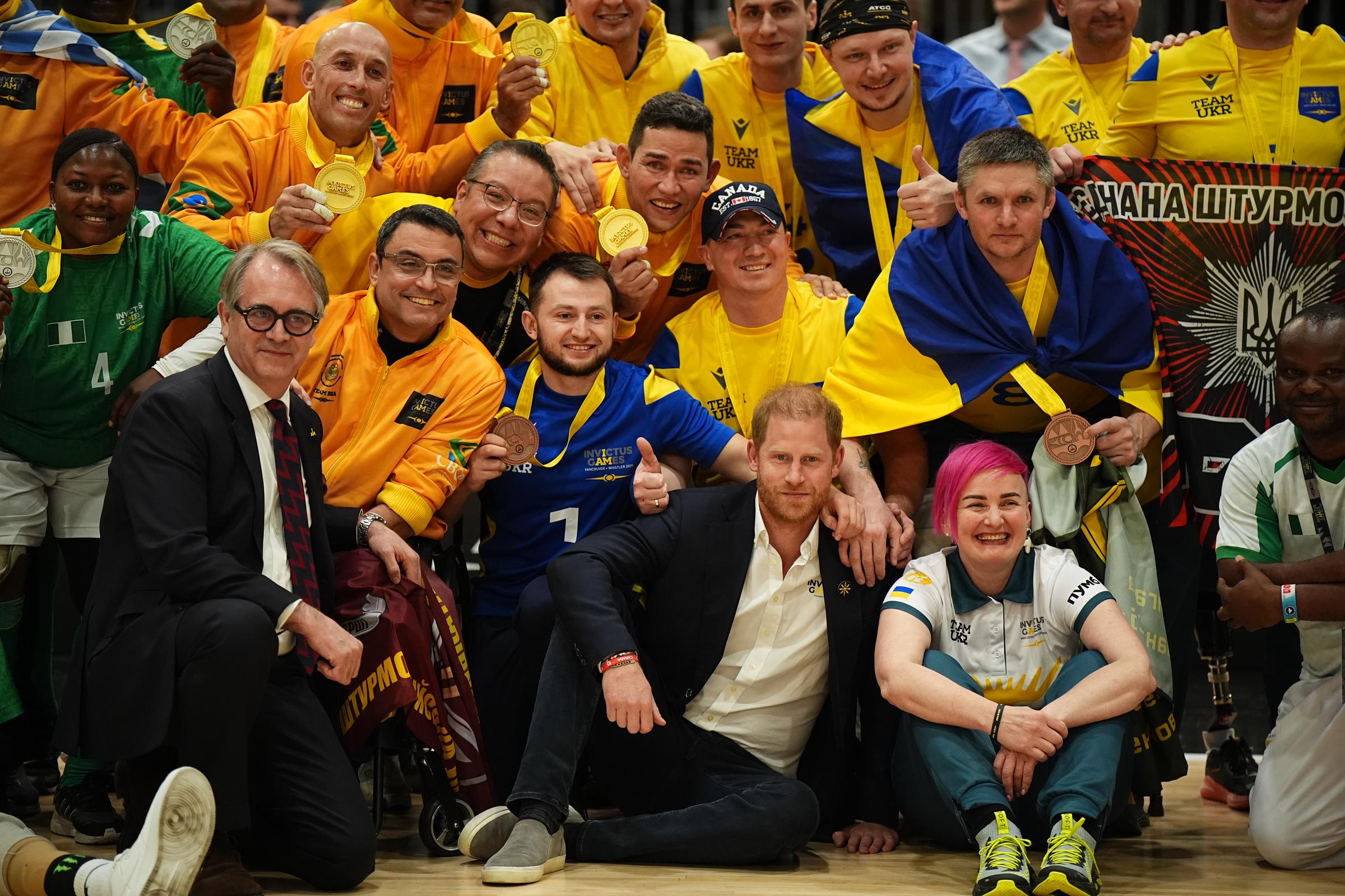 The Duke of Sussex, Prince Harry sits on the floor with competitors from all over world at the 2025 Invictus Games in Vancouver, Canada on February 15, 2025 | Source: Getty Images