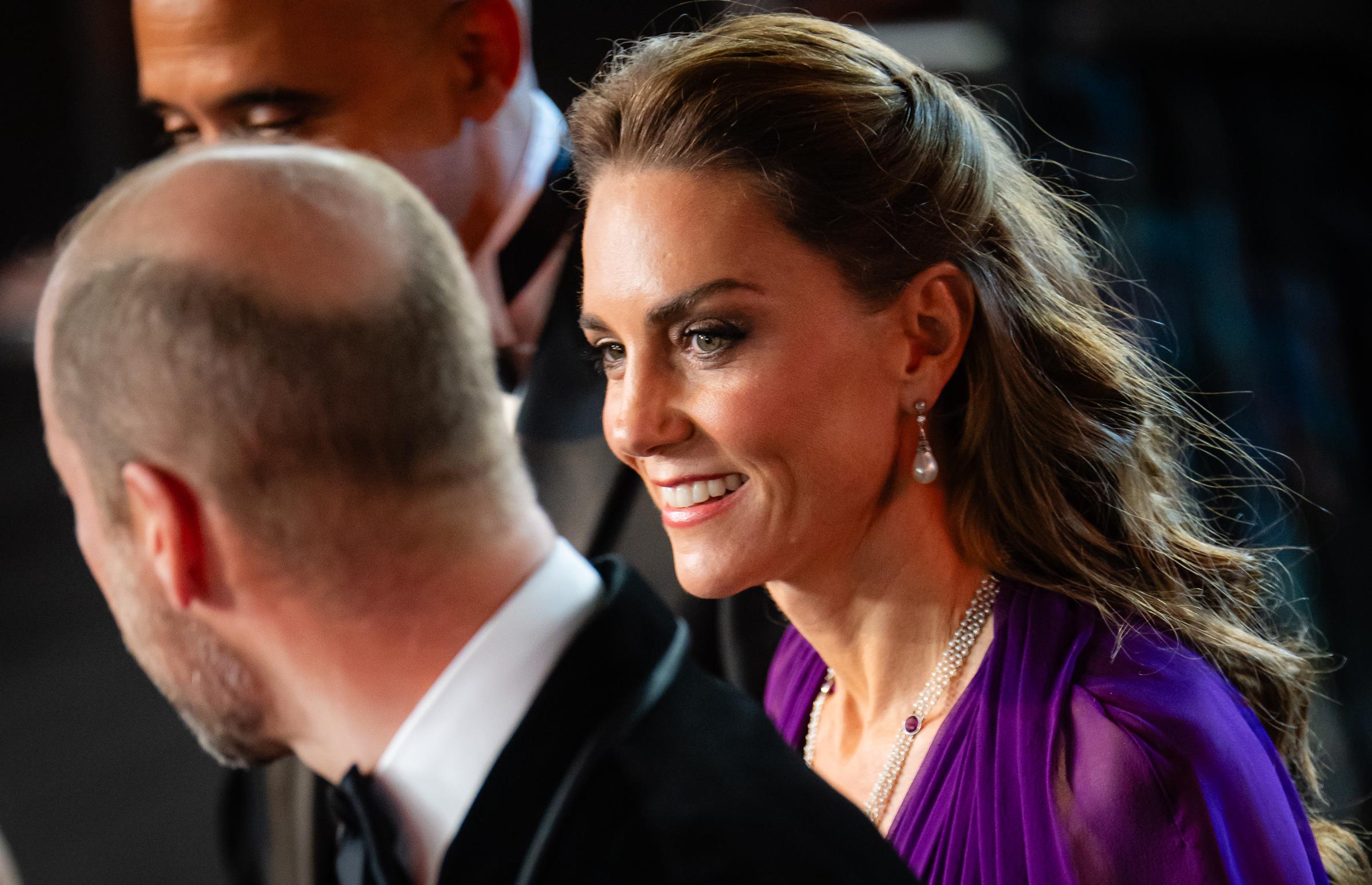 Catherine is pictured with Prince William at the "Digger" Film and TV Charity Royal Film Performance and Global Premiere inside Leicester Square Gardens in London on September 22, 2026. The close-up shows her pearl drop earrings and necklace with her purple gown.