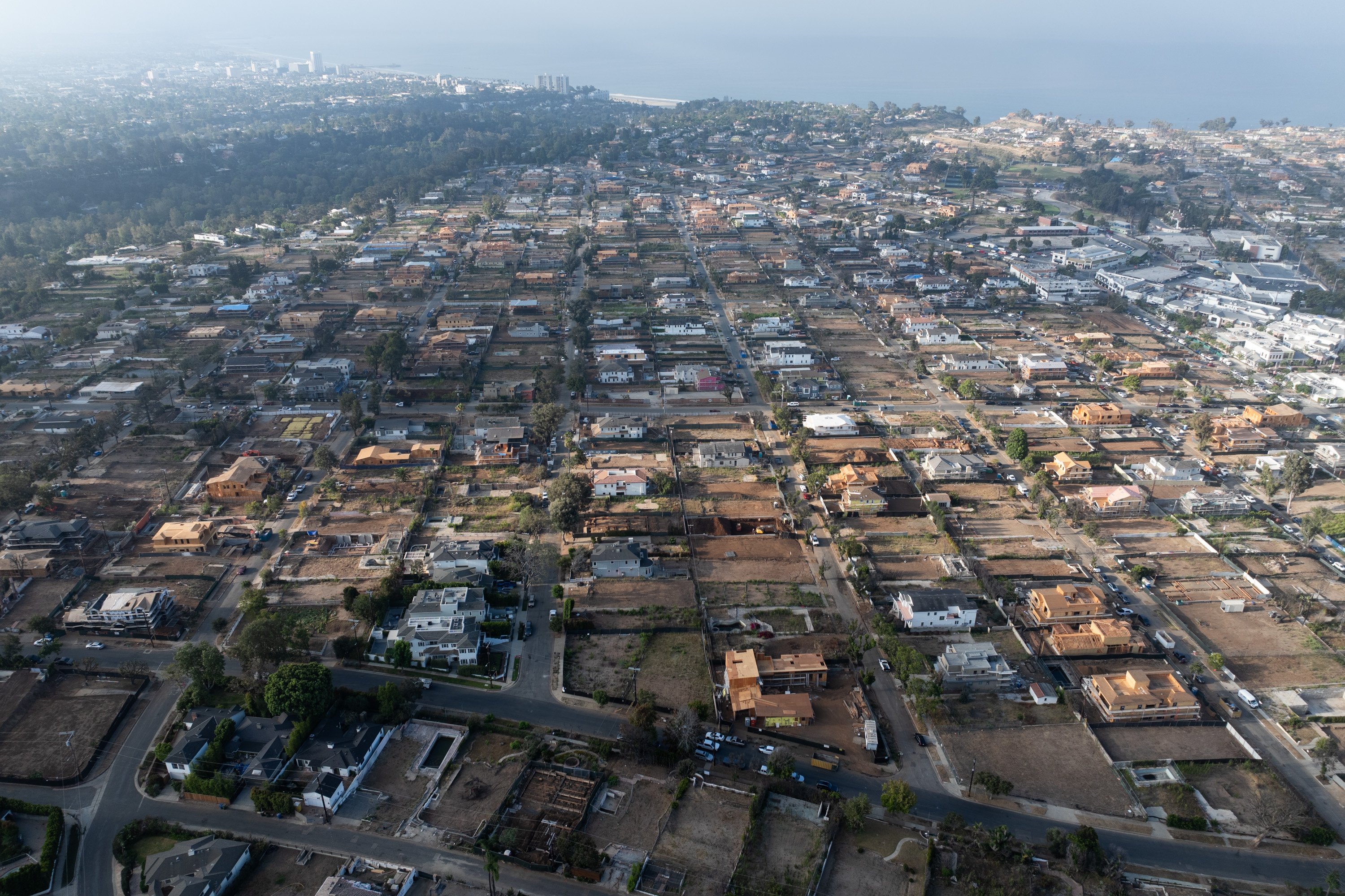 From the air, burned homes and damaged streets stretched across large sections of Pacific Palisades after the fire. | Source: Getty Images