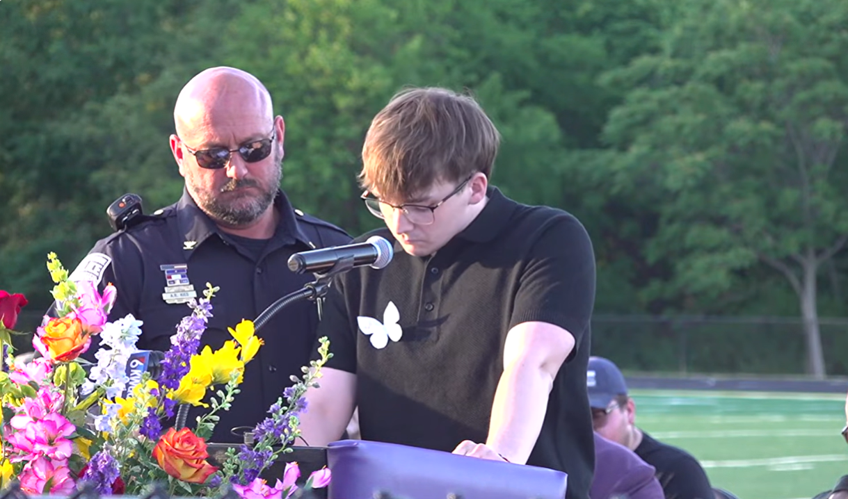 Johnathan McFarland pauses while speaking during a community vigil for his family members killed in the Muscatine, Iowa, shooting spree, June 3, 2026. The 22-year-old, who was the sole surviving sibling, thanked supporters and paid tribute to his loved ones during emotional remarks. | Source: YouTube/WQAD News 8