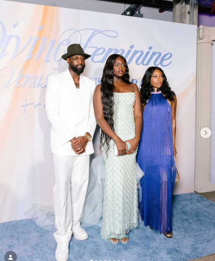 At a formal event, Dwyane Wade stands beside his family. Gabrielle Union is on the right in a sleek blue gown, while Zaya Wade stands in the center wearing a soft mint strapless dress. | Source: Instagram/gabunion