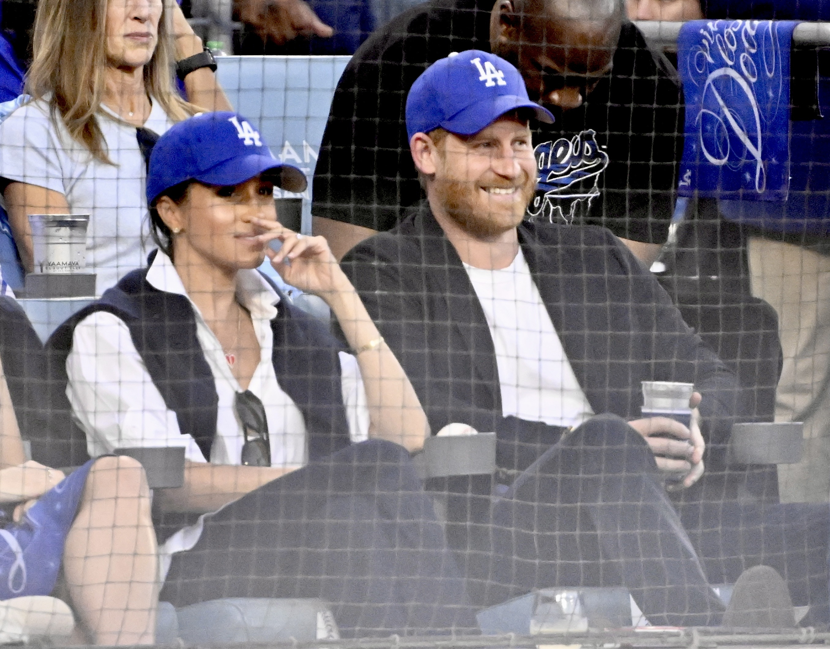 Prince Harry and Meghan Markle look on during a World Series Baseball game between the Toronto Blue Jays and Los Angeles Dodgers on October 28, 2025 | Source: Getty Images