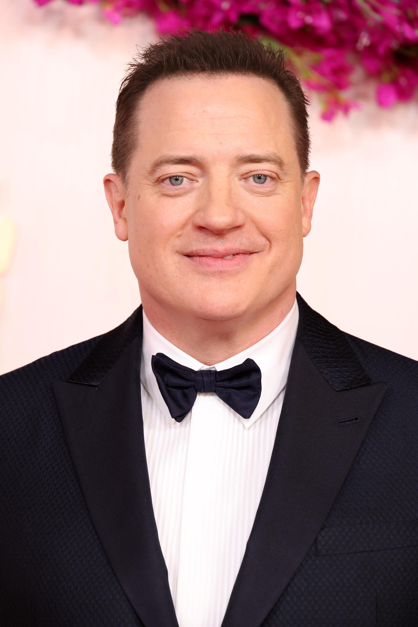 Fraser returned to the Academy Awards in March 2024, this time wearing a navy Giorgio Armani tuxedo after his previous year's Best Actor victory. | Source: Getty Images