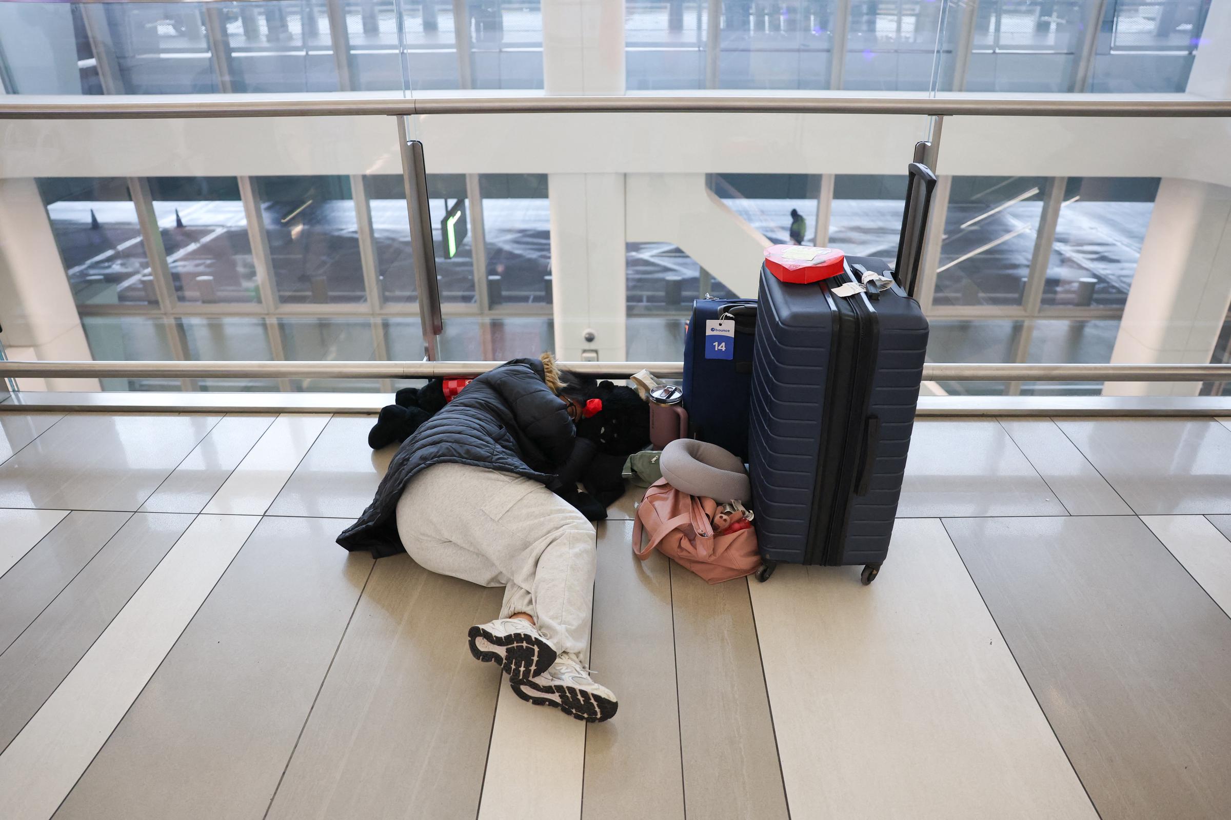 Travelers wait inside Terminal B at LaGuardia Airport during a ground stop following an overnight accident involving an Air Canada Express CRJ-900 collision with a Port Authority fire truck on March 23, 2026, in New York City | Getty Images