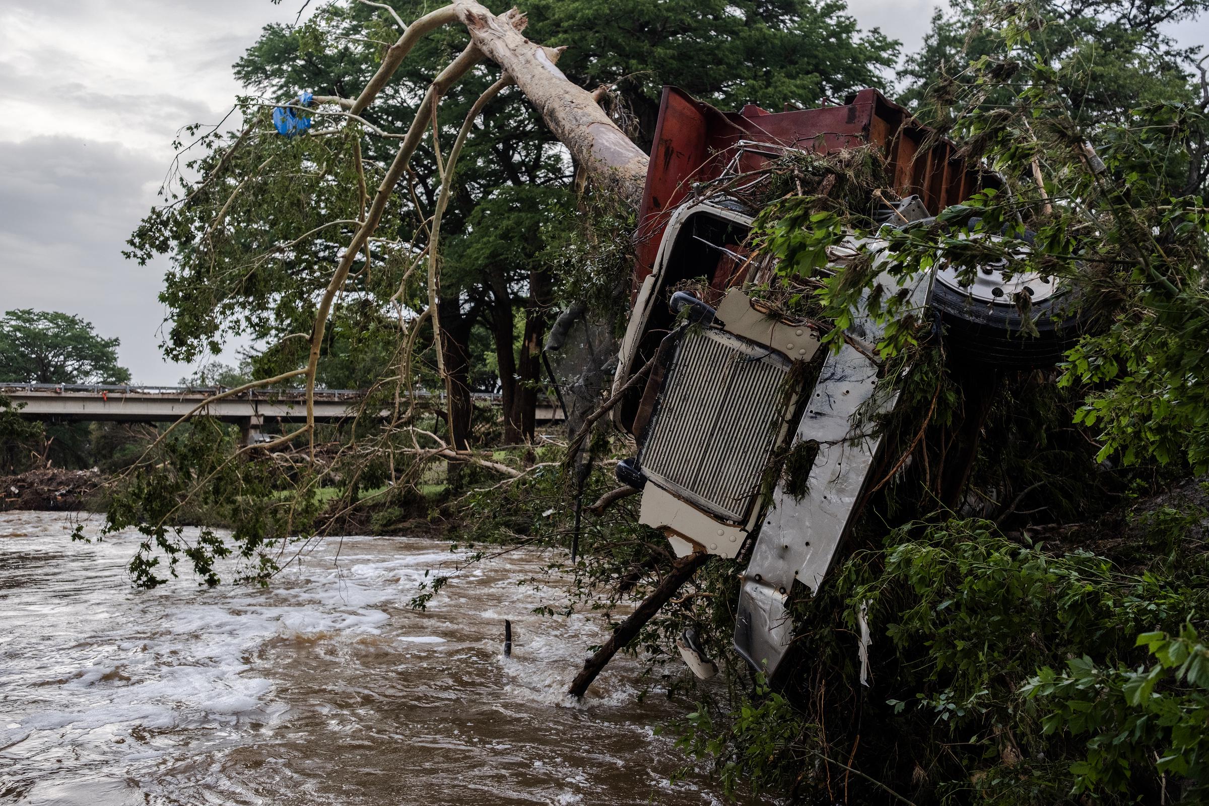 A large truck impaled on a tree after flash flooding on the bank of Guadalupe River in Center Point, Texas on July 5, 2025. | Source: Getty Images