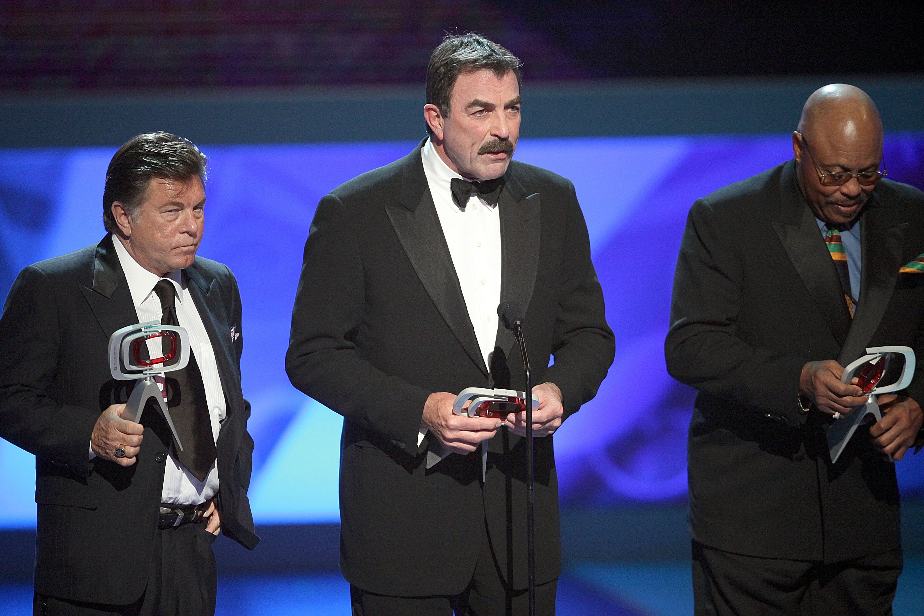 Tom Selleck, Larry Manetti, and Roger E. Mosley of " Magnum P.I." onstage during the 7th Annual TV Land Awards held at Gibson Amphitheatre in California on April 19, 2009 | Source: Getty Images
