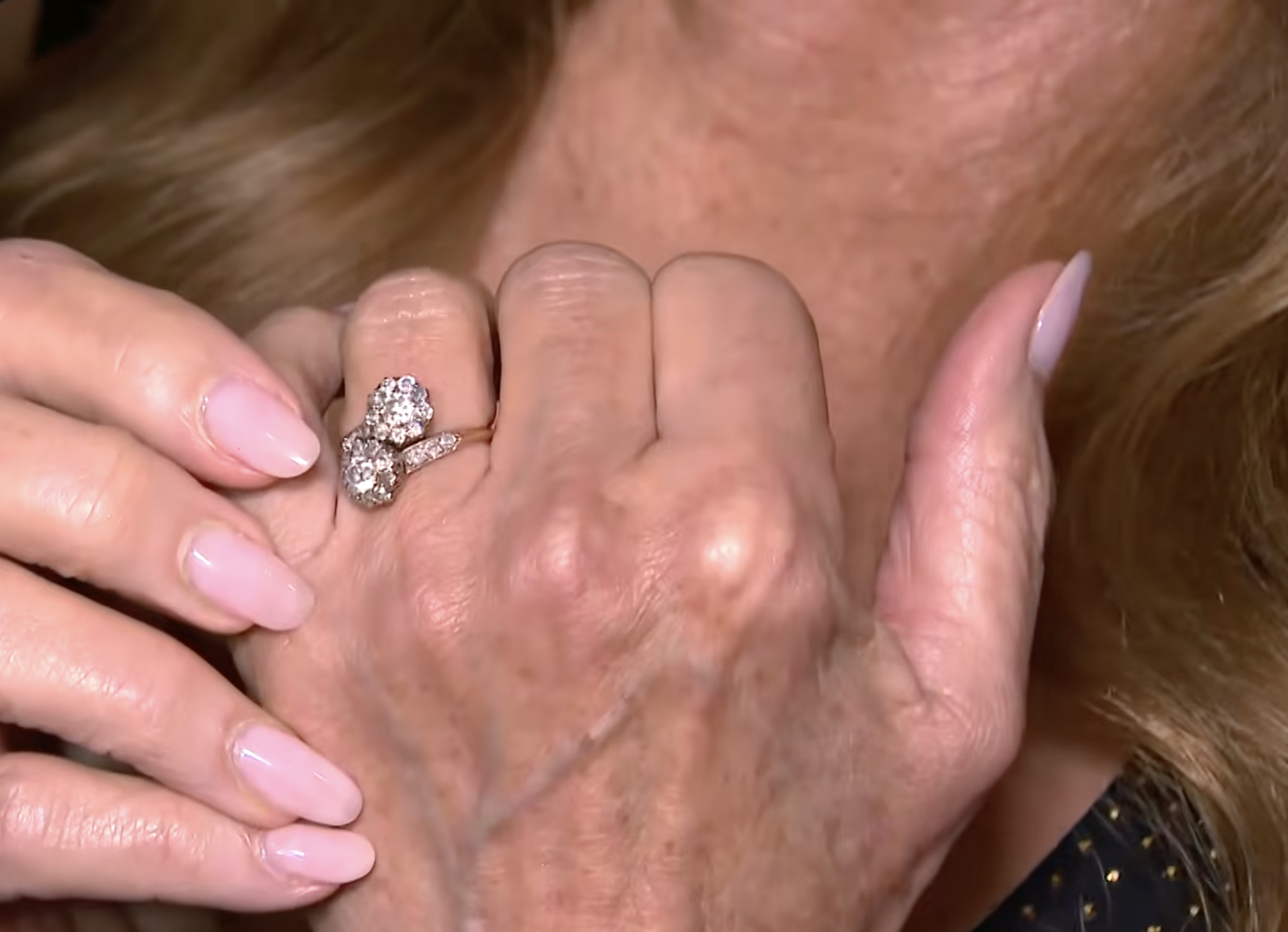 Seymour explained that the ring is vintage and meaningful because it was not designed around one solitary stone. To her, the piece symbolizes two people standing together after separate pasts. | Source: YouTube/Entertainment Tonight