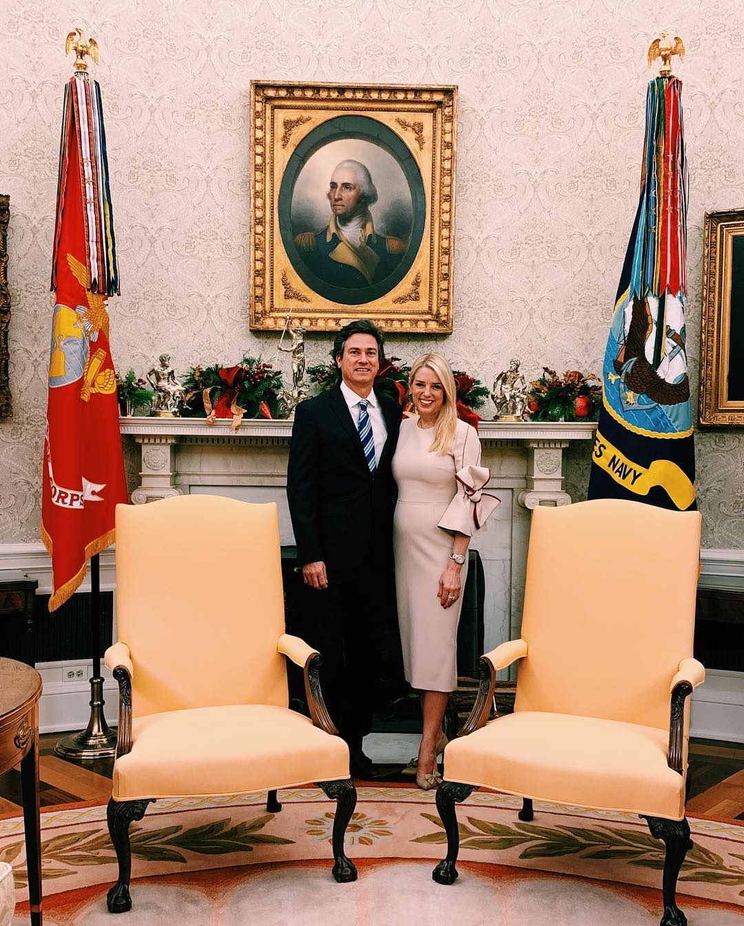 Pam Bondi and John Wakefield pose inside the White House during the holiday season in 2018 | Source: Instagram.com/pambondi