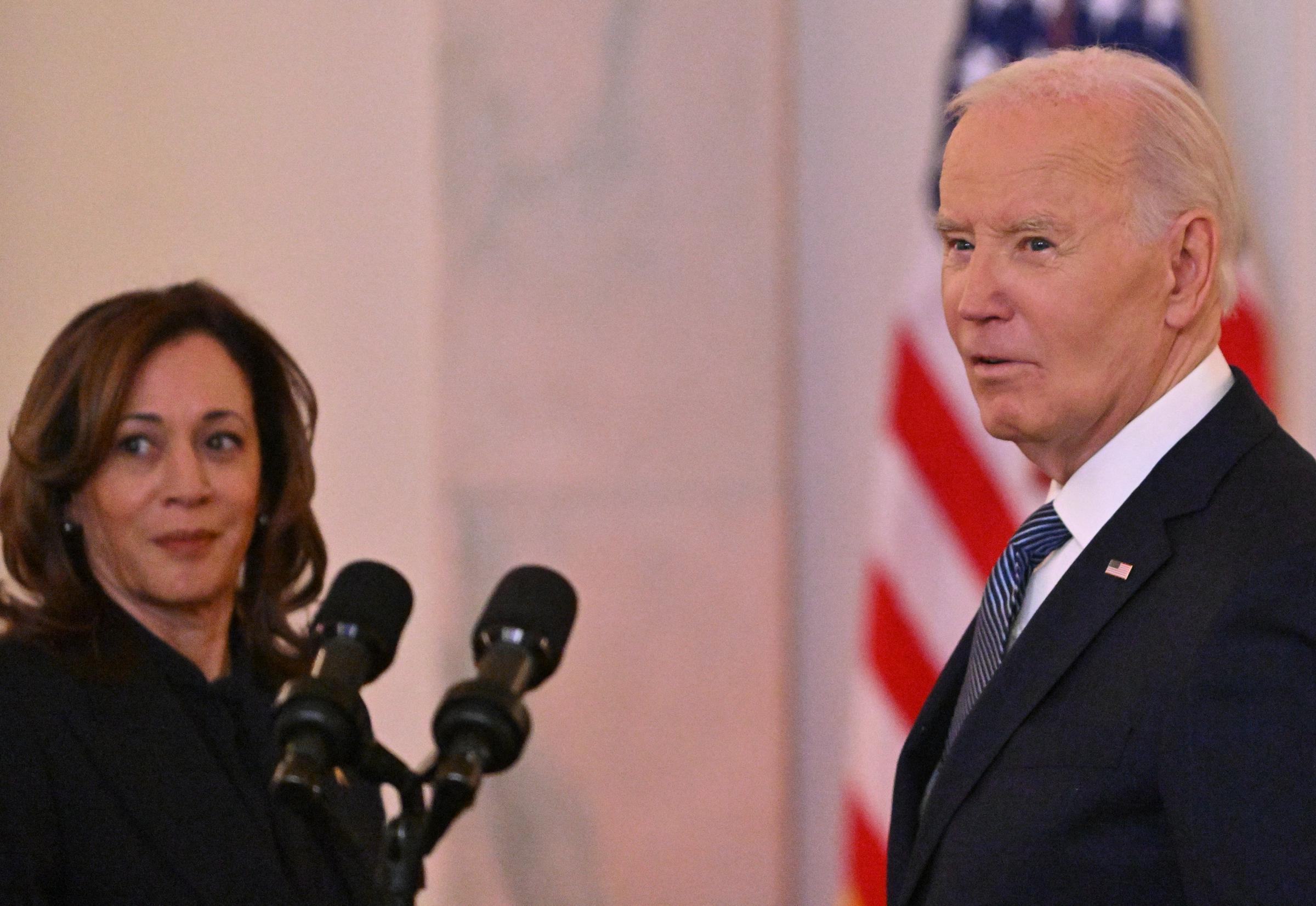 President Joe Biden takes a reporter's question as Vice President Kamala Harris looks on January 15, 2025 | Source: Getty Images