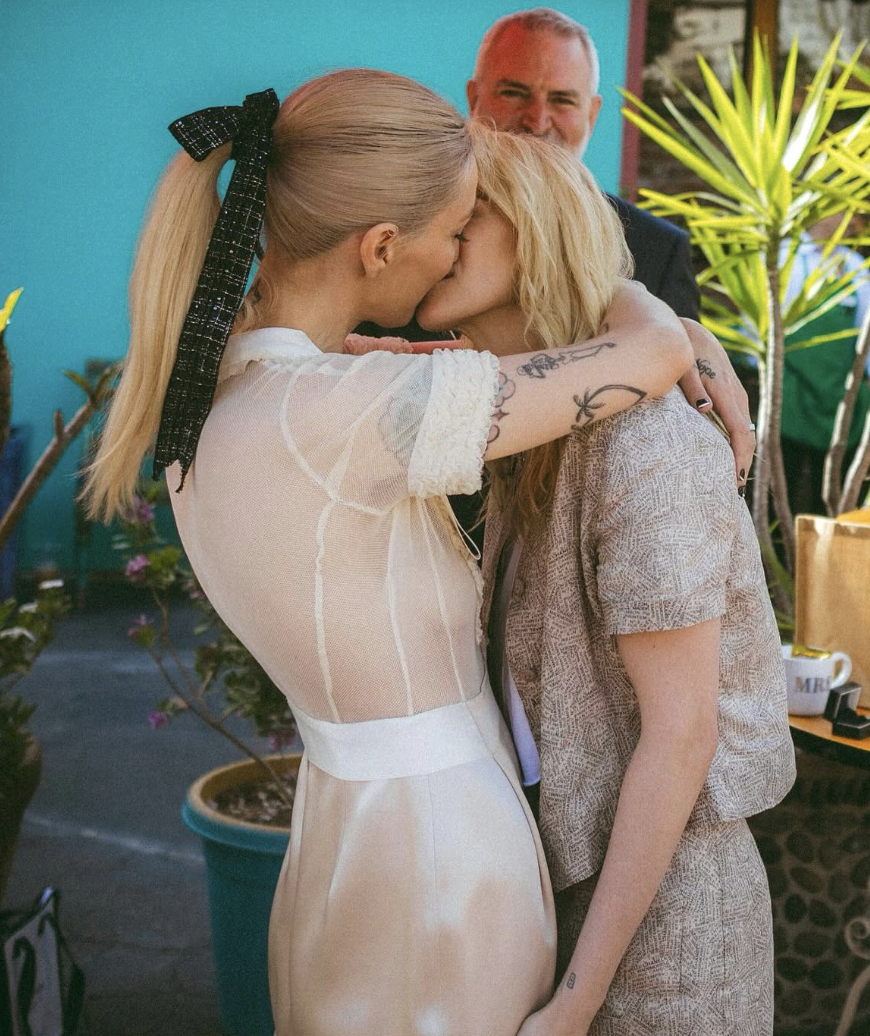 Dylan Meyer and Kristen Stewart sharing a kiss on their wedding day from a post dated April 25, 2025. | Source: Instagram/pagesix