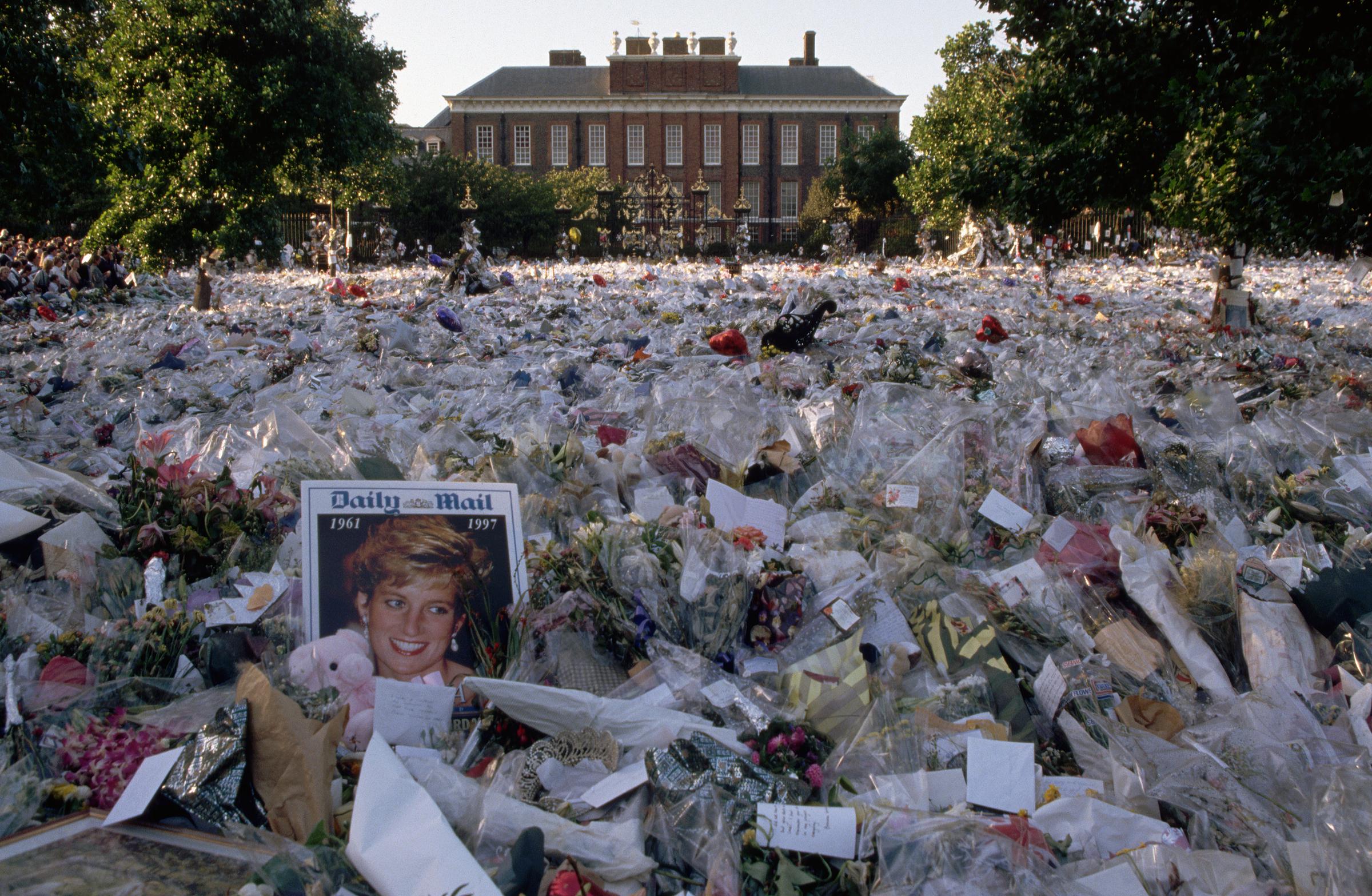 A multi-colored sea of floral tributes to Diana, Princess of Wales, lie outside the gates of her London home on September 6, 1997. | Source: Getty Images