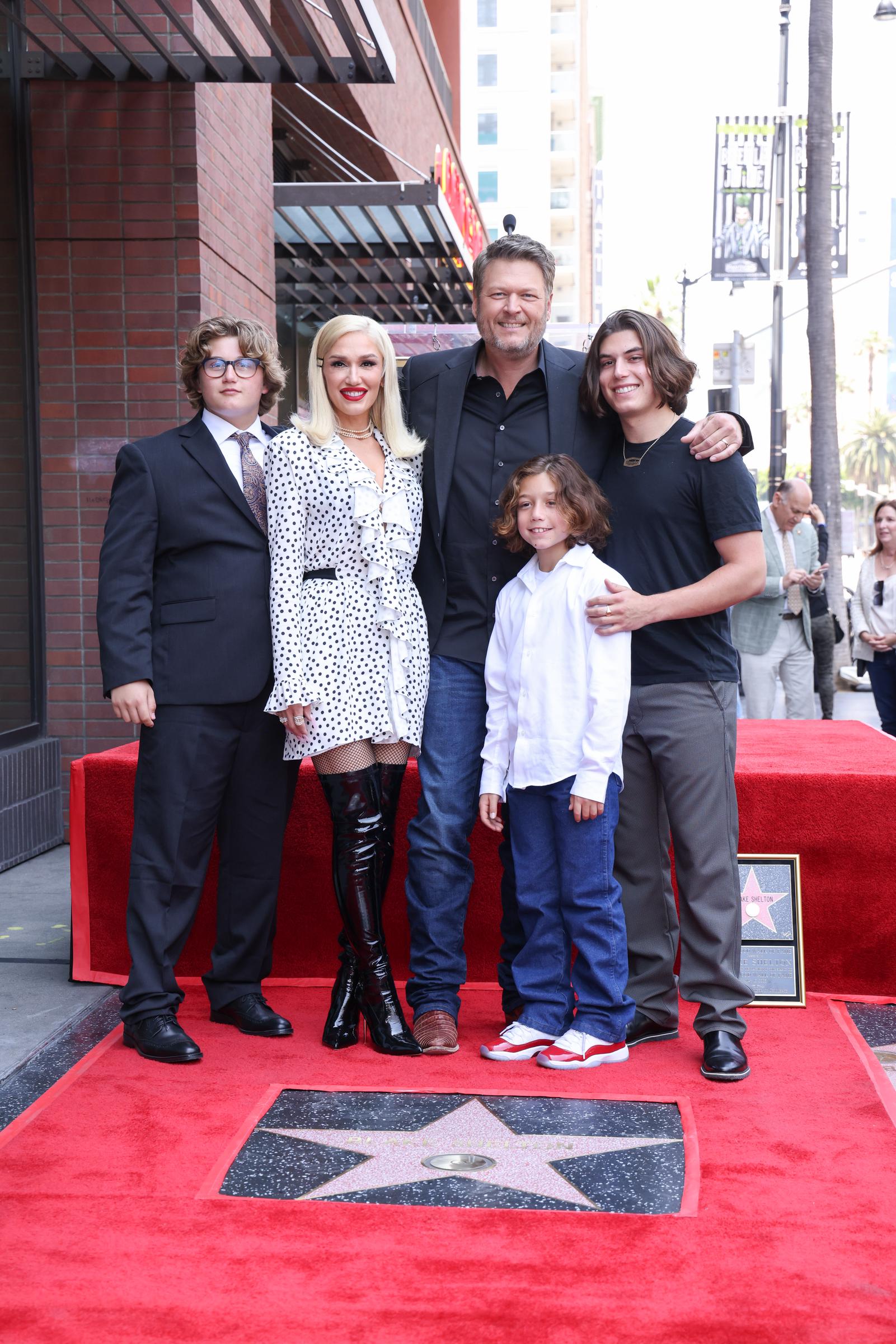 Gwen Stefani, Blake Shelton, Zuma Rossdale, and Apollo Rossdale proudly celebrated a major career milestone as a family. At this event, they attended the ceremony honoring Shelton with a star on the Hollywood Walk of Fame on May 12, 2023, in Los Angeles, California. | Source: Getty Images