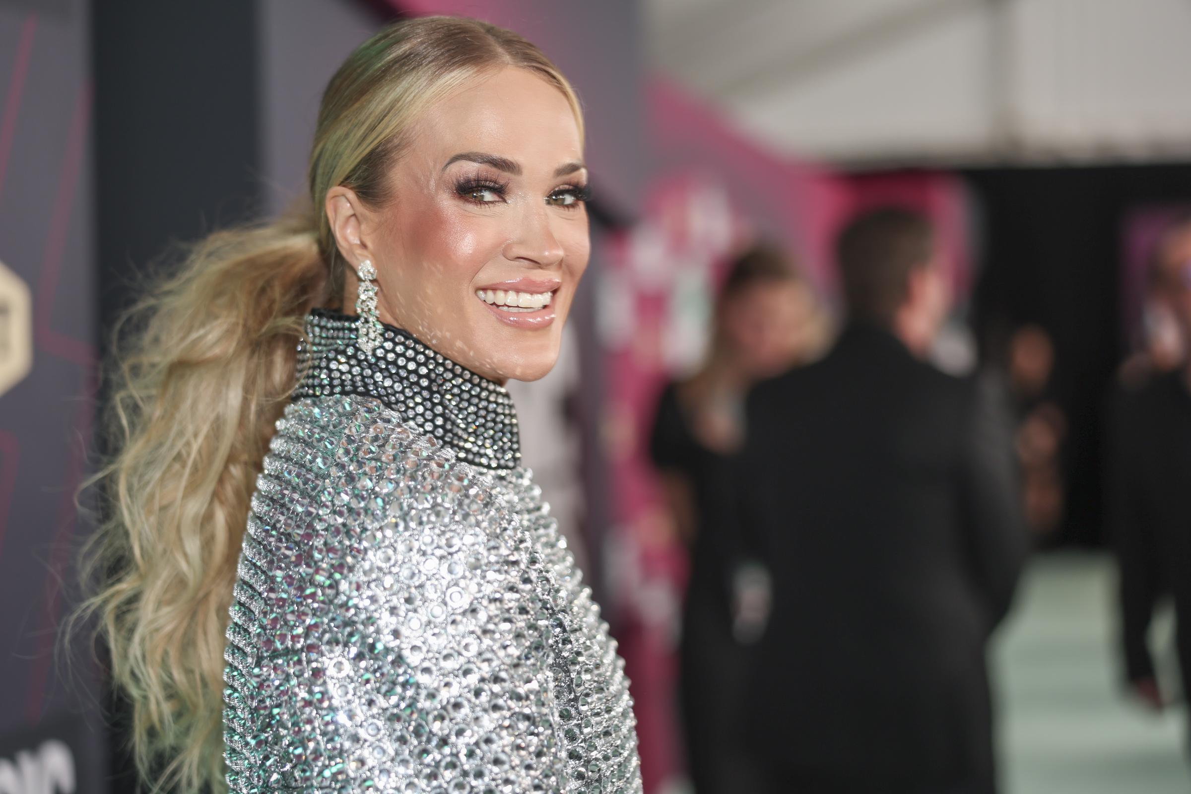 With her hair pulled back into a low style, Underwood revealed more of her face than in many of her red carpet appearances. Photos from the event became part of the ongoing online discussion about how her appearance has changed over the years. | Source: Getty Images