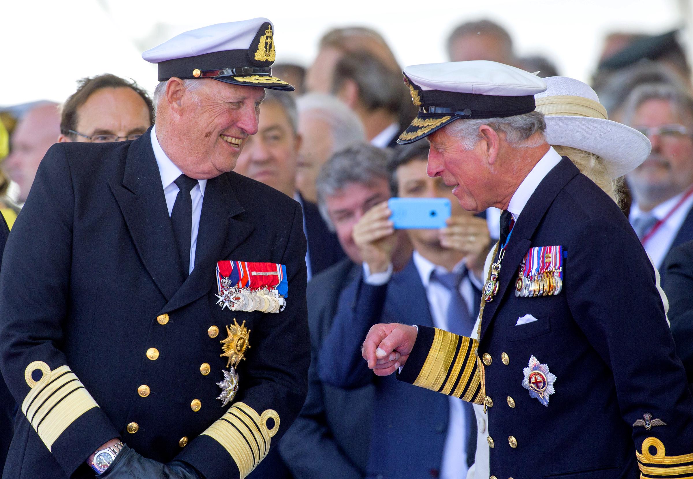 Then-King Harald of Norway and Prince Charles, Prince of Wales attend the International Ceremony at Sword Beach to commemorate the 70th anniversary of the D-Day landings on June 6, 2014 in Ouistreham, France | Source: Getty Images