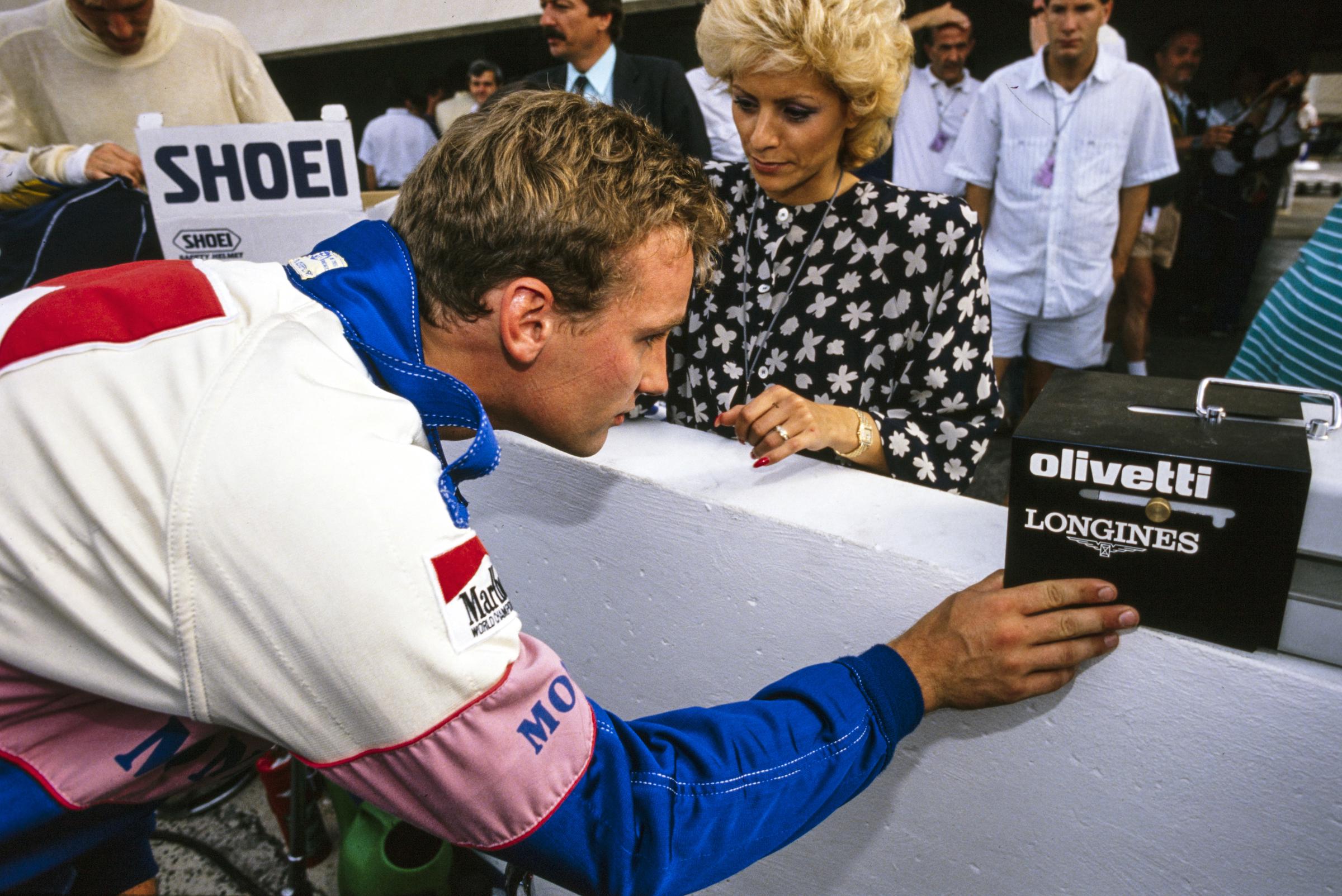 Bertrand Gachot looks at the times on a monitor during the French Grand Prix at Circuit Paul Ricard, France, on July 9, 1989. | Source: Getty Images