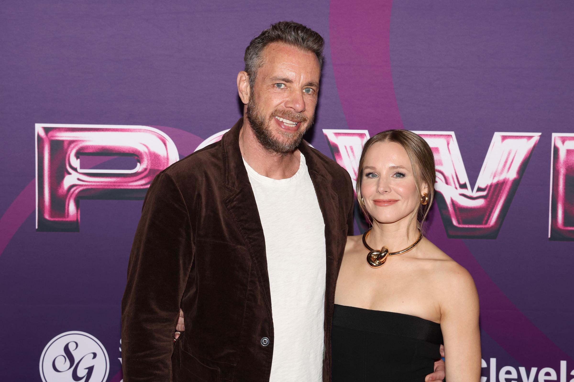 Dax Shepard and Kristen Bell pose together at the Power of Love gala in Las Vegas. With a velvet blazer and her classic black dress, the couple bring warmth and red carpet poise to the charity event.