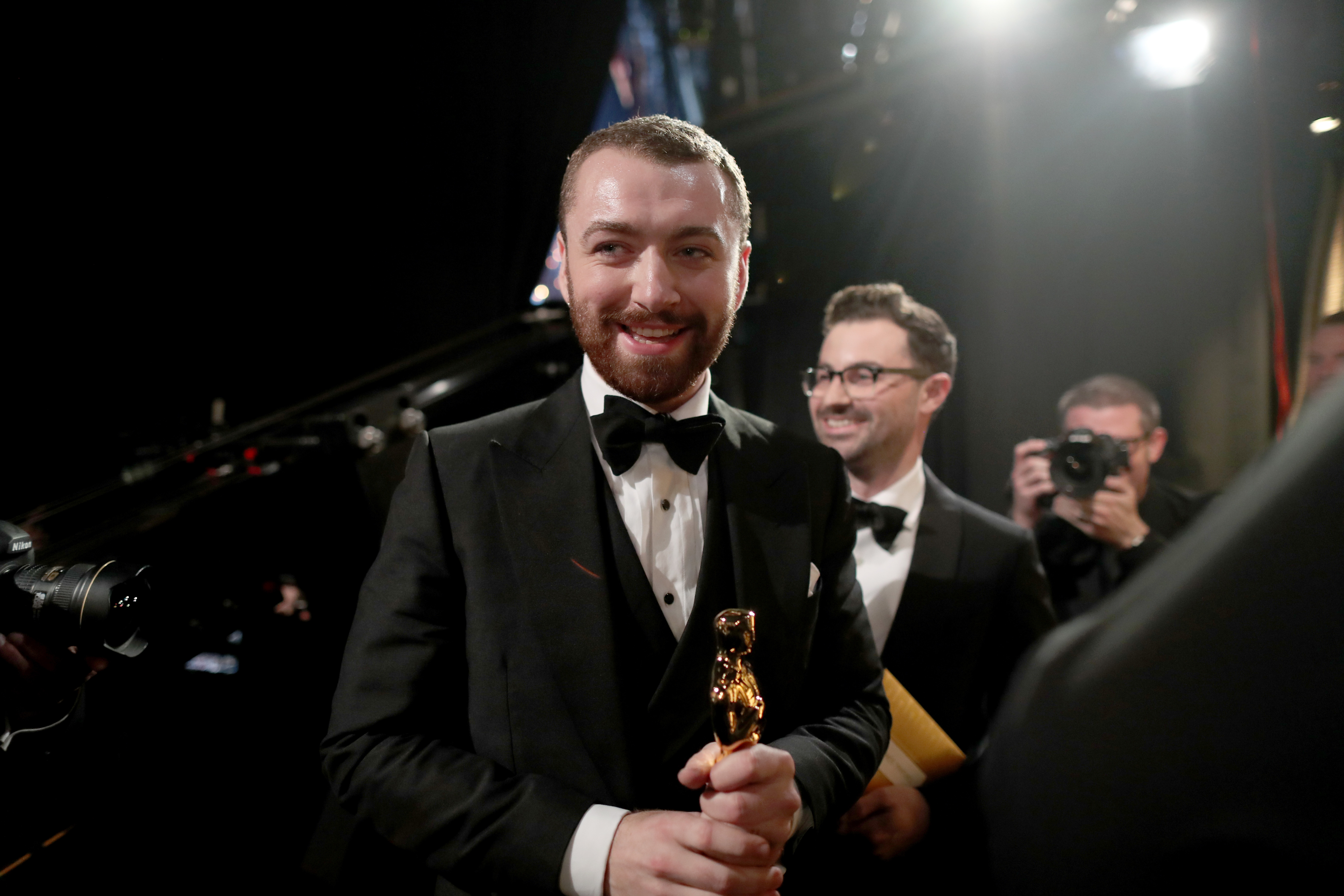 Sam Smith and Jimmy Napes winners of the Best Original Song award for "Writing's on the Wall" from "Spectre" seen backstage at the 88th Annual Academy Awards on February 28, 2016 | Source: Getty Images