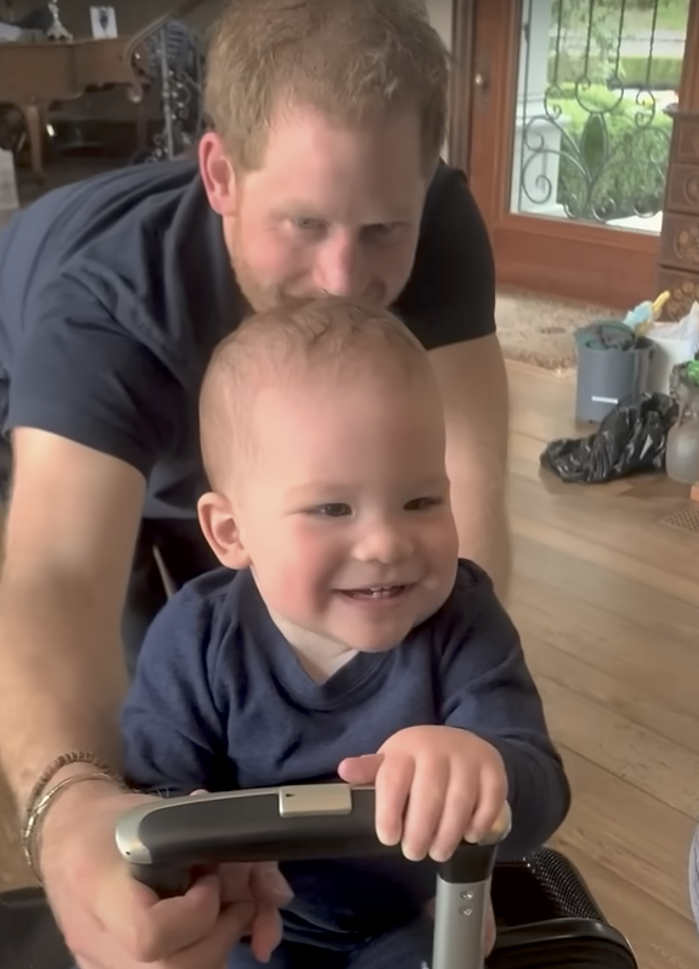 Prince Harry playing with Prince Archie at home | Source: YouTube/LMT