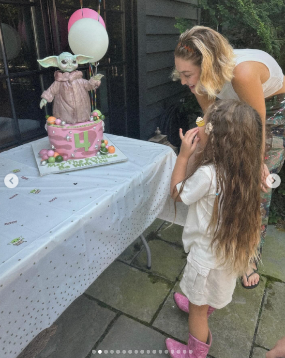 Gigi Hadid's daughter, Khai, admiring her birthday cake | Source: Instagram/gigihadid