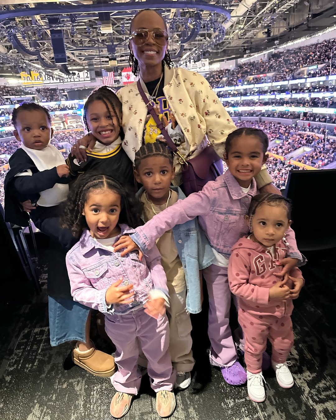 Shante Broadus poses with her grandchildren | Source: Instagram/bosslady_ent