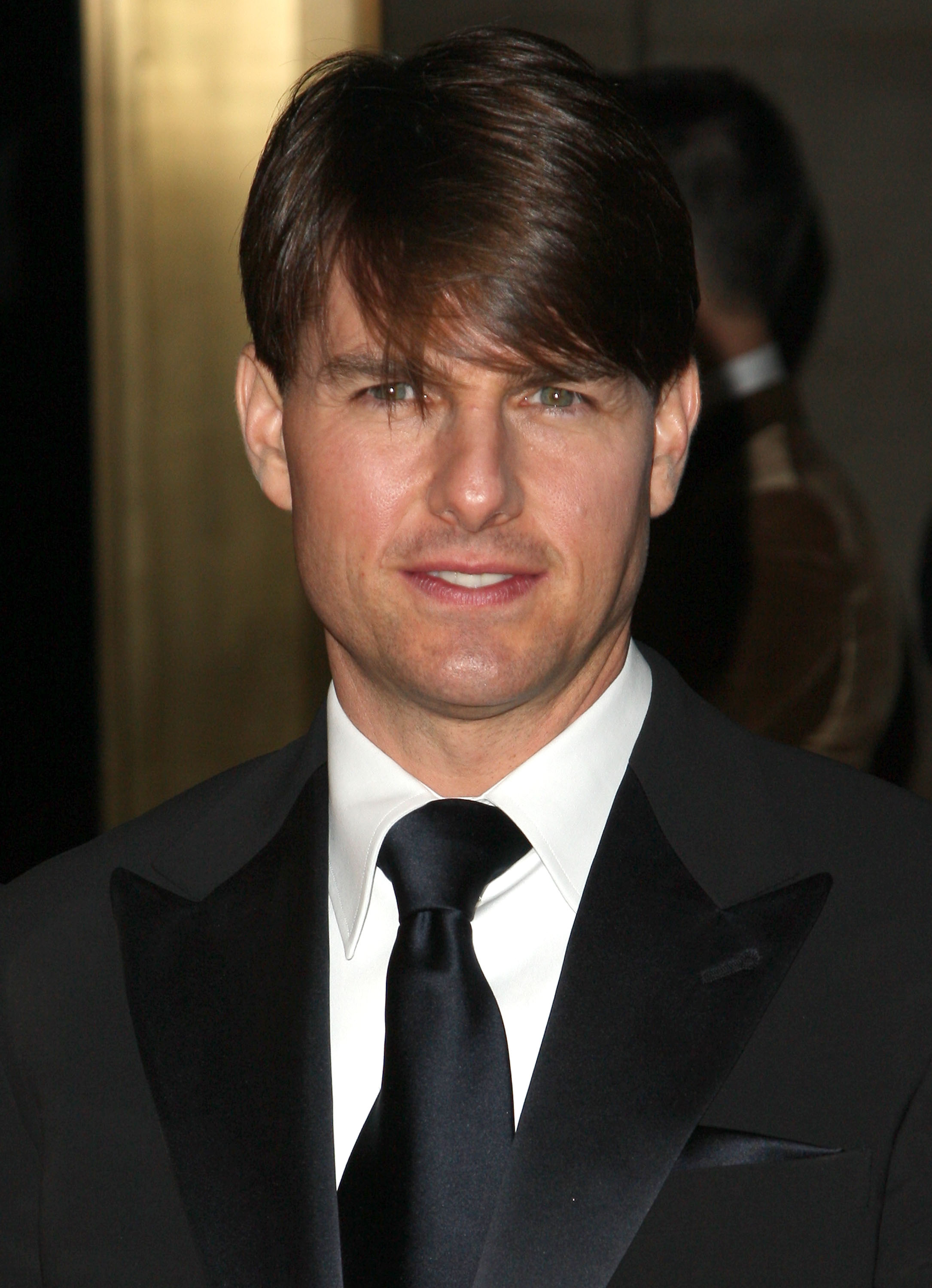 Tom Cruise attends an event in a classic black suit and tie, offering a glimpse of the actor’s longtime Hollywood image before his latest GQ photoshoot. | Source: Getty Images