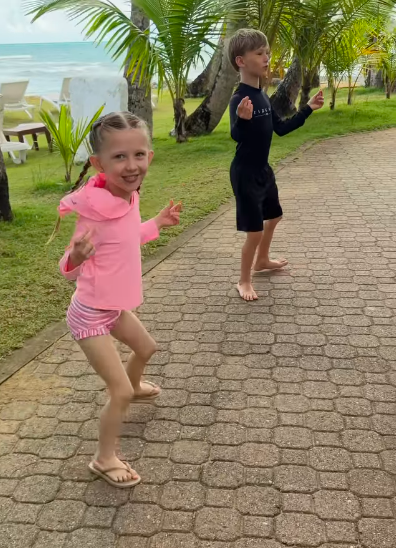 Two Baldwin kids playfully walking around like crabs. | Source: Instagram/hilariabaldwin and alecbaldwininsta