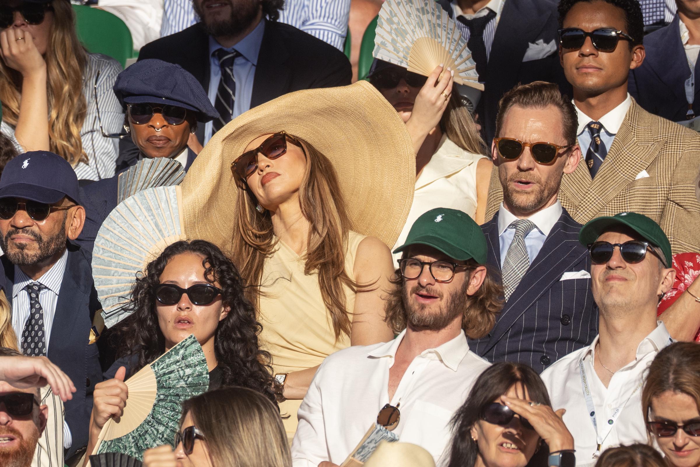 From a wider perspective, the brim's scale became difficult to ignore among the closely packed crowd. The image helped turn a luxury fashion moment into a much broader conversation about courtesy at major sporting events. | Source: Getty Images