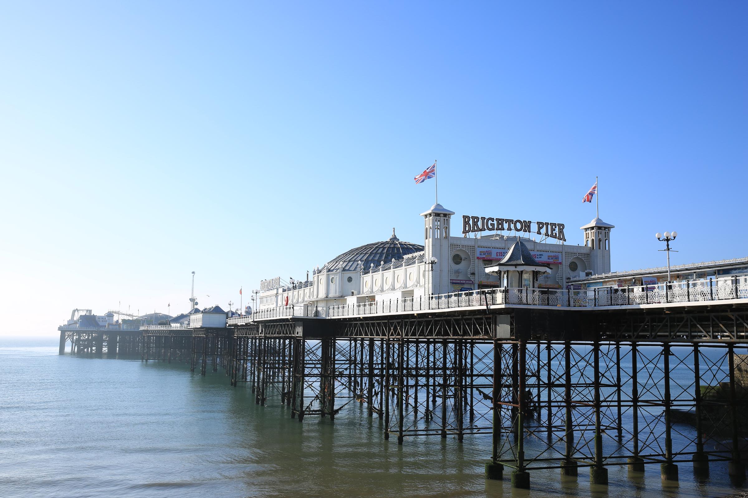 Brighton Pier pictured along the coastline where investigators continue examining the final movements of the sisters found in nearby waters | Source: Getty Images
