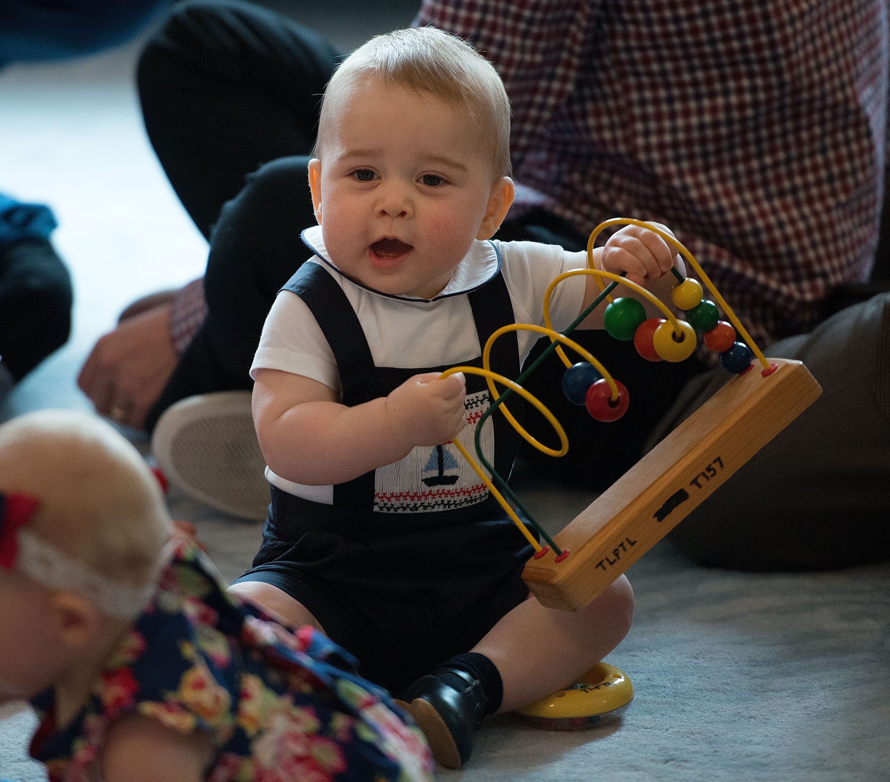 Still a baby, George joined other children at a parents’ group event at Government House in Wellington on April 9. The playful moment came during William and Catherine’s first official overseas trip with their son.