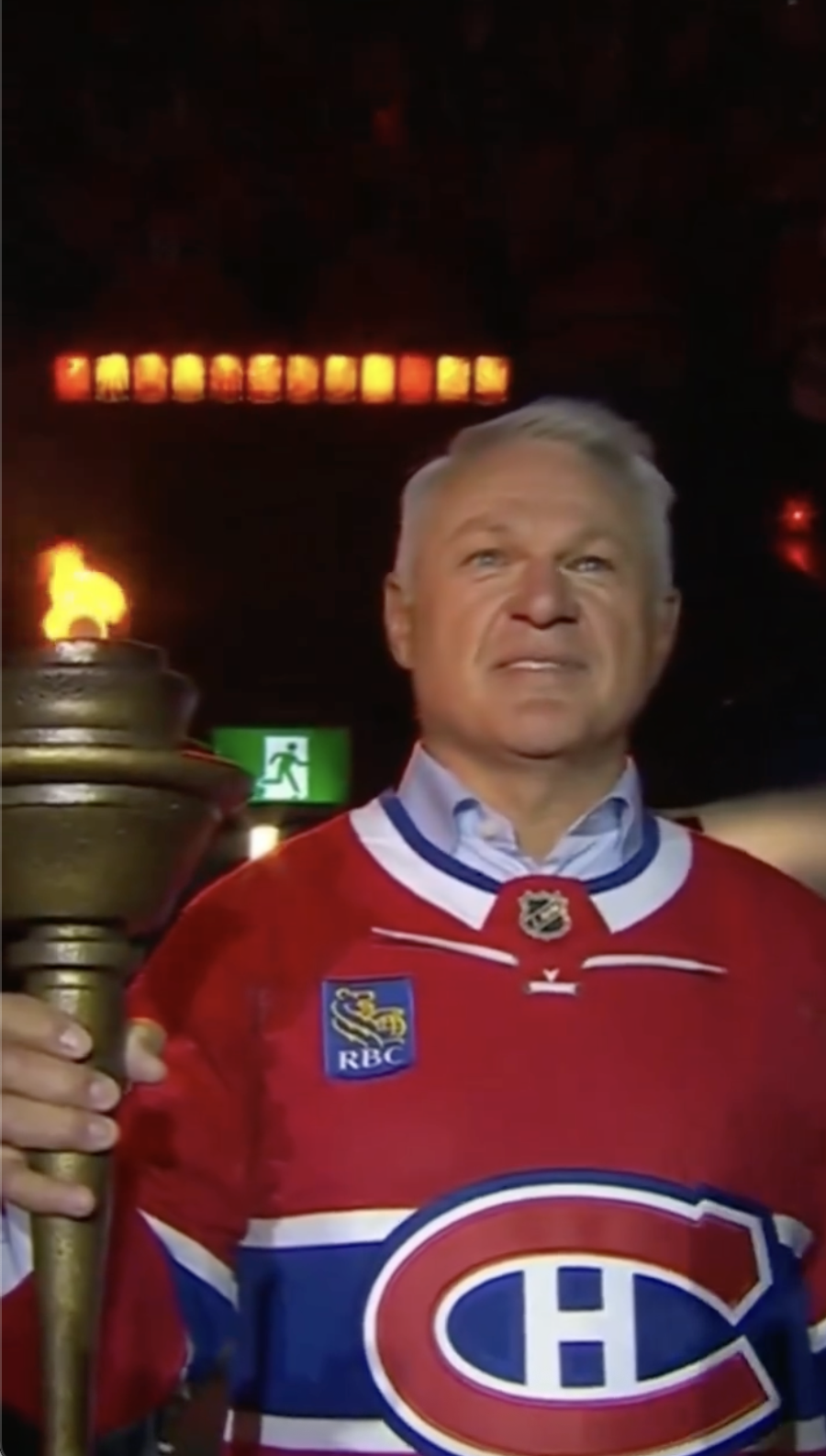Claude Lemieux carries the ceremonial torch at Montreal's Bell Centre before Game 3 of the Eastern Conference Finals between the Canadiens and Hurricanes in May 2026. | Source: Instagram/rds