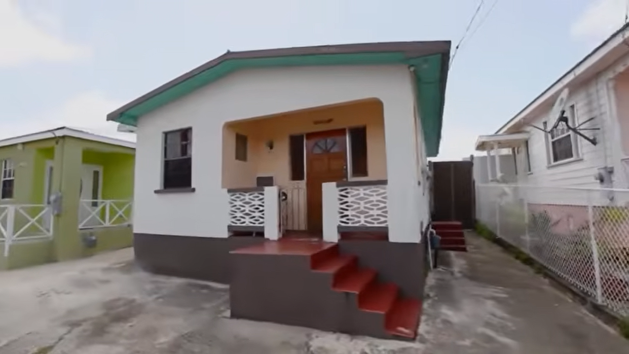 This modest house in Bridgetown, Barbados, is where Rihanna spent much of her childhood before becoming one of the world's biggest music stars. She famously returned to the home in 2012 to give Oprah Winfrey a personal tour for "Oprah's Next Chapter," sharing stories about her upbringing and the neighborhood that shaped her early years. | Source: YouTube/@gabetoney8290