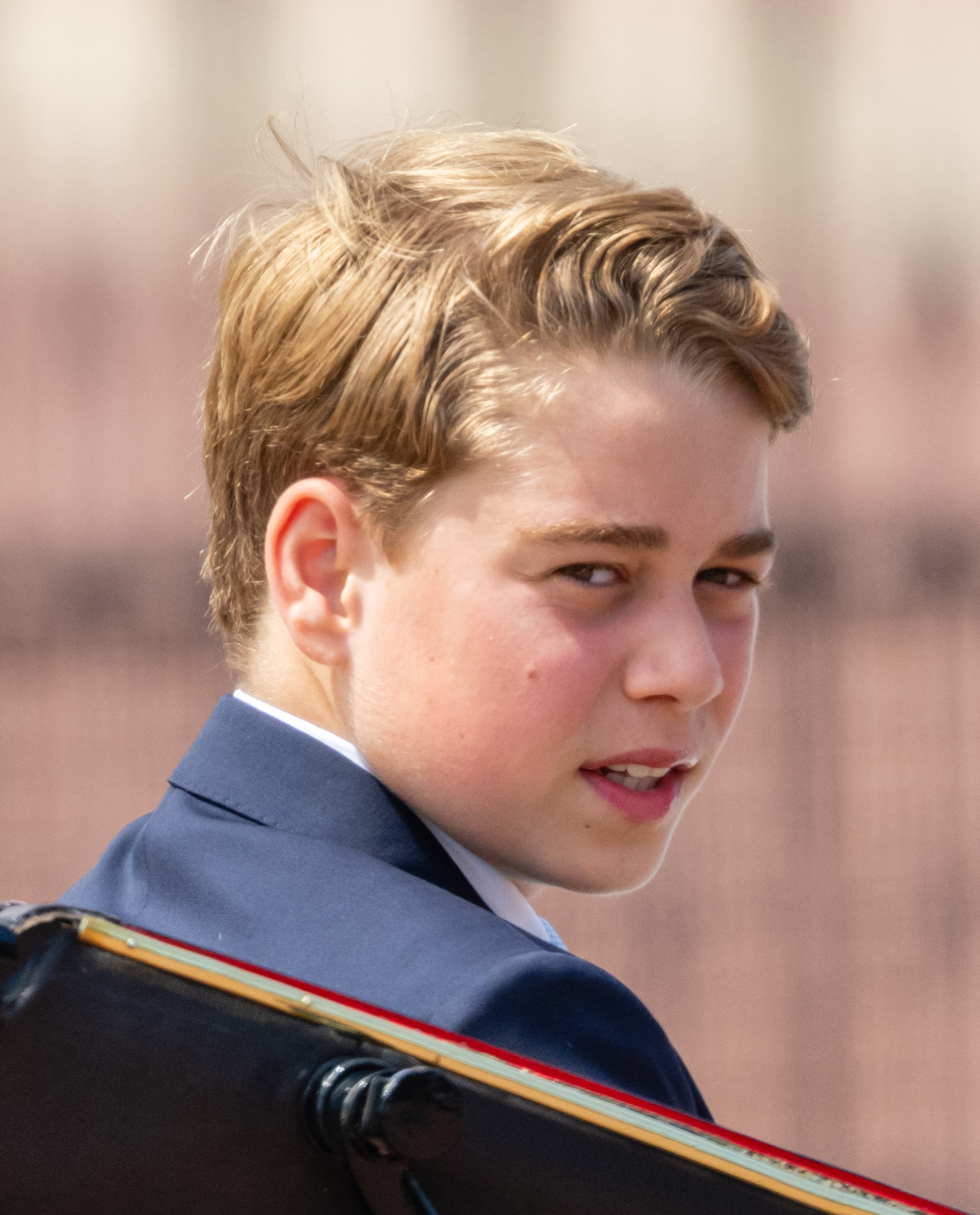 Prince George looks over his shoulder during Trooping the Colour in London on June 13, 2026. Just months later, the young prince began his first term at Eton, where boarding life brought new responsibilities. | Source: Getty Images