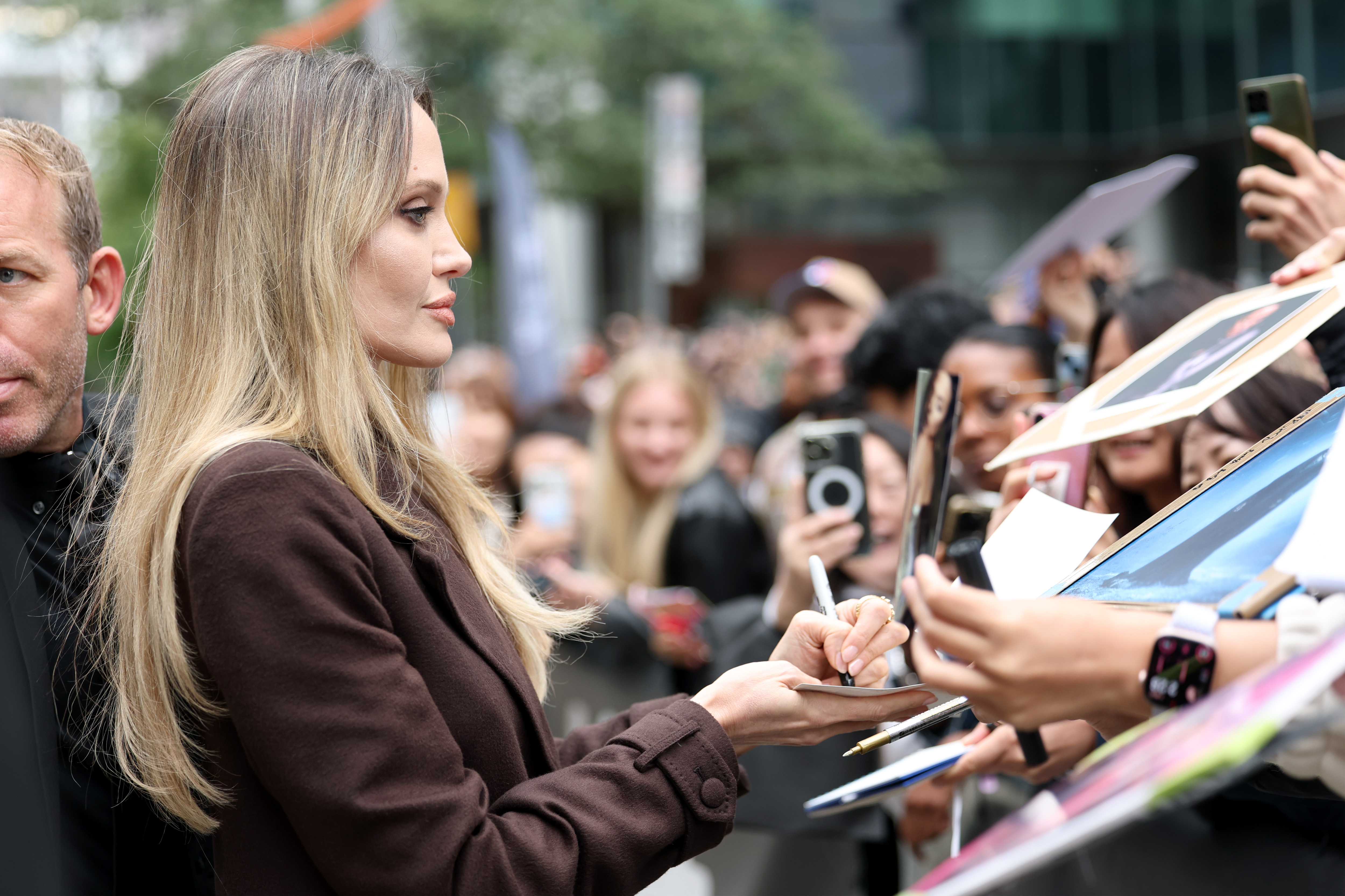 Angelina Jolie signs autographs during the premiere of "Couture" at the International Film Festival in Toronto held at the Princess of Wales Theater, Ontario on September 7, 2025 | Source: Getty Images