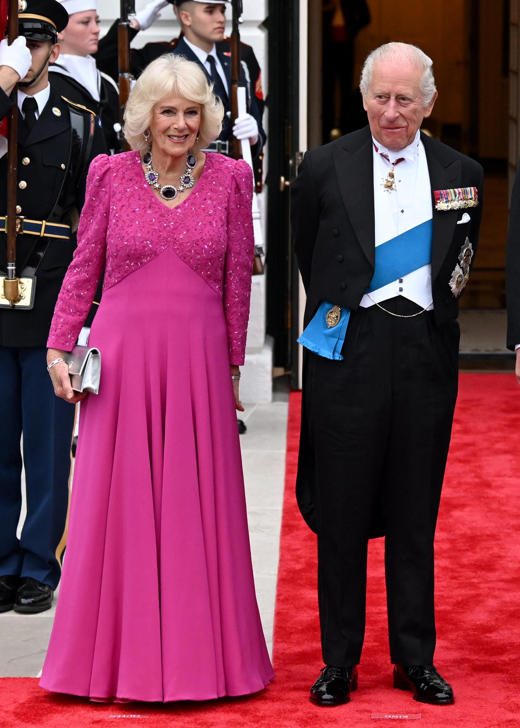 Queen Camilla and King Charles III arrive together on the red carpet at the White House state dinner | Source: Getty Images