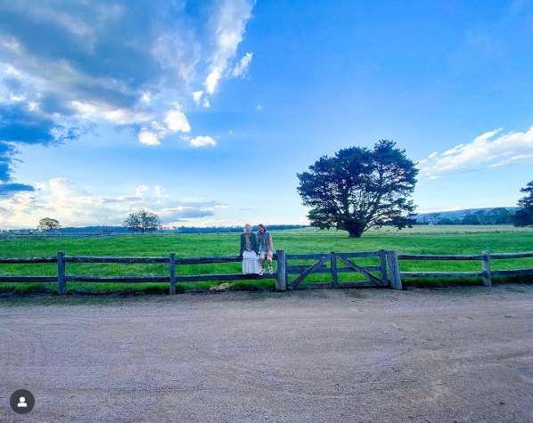 A wide shot captures the expansive fields and signature split-rail fence that frame the property, with towering trees and open sky creating a picture-perfect pastoral scene. From a post dated April 10, 2021. | Source: Instagram/nicolekidman