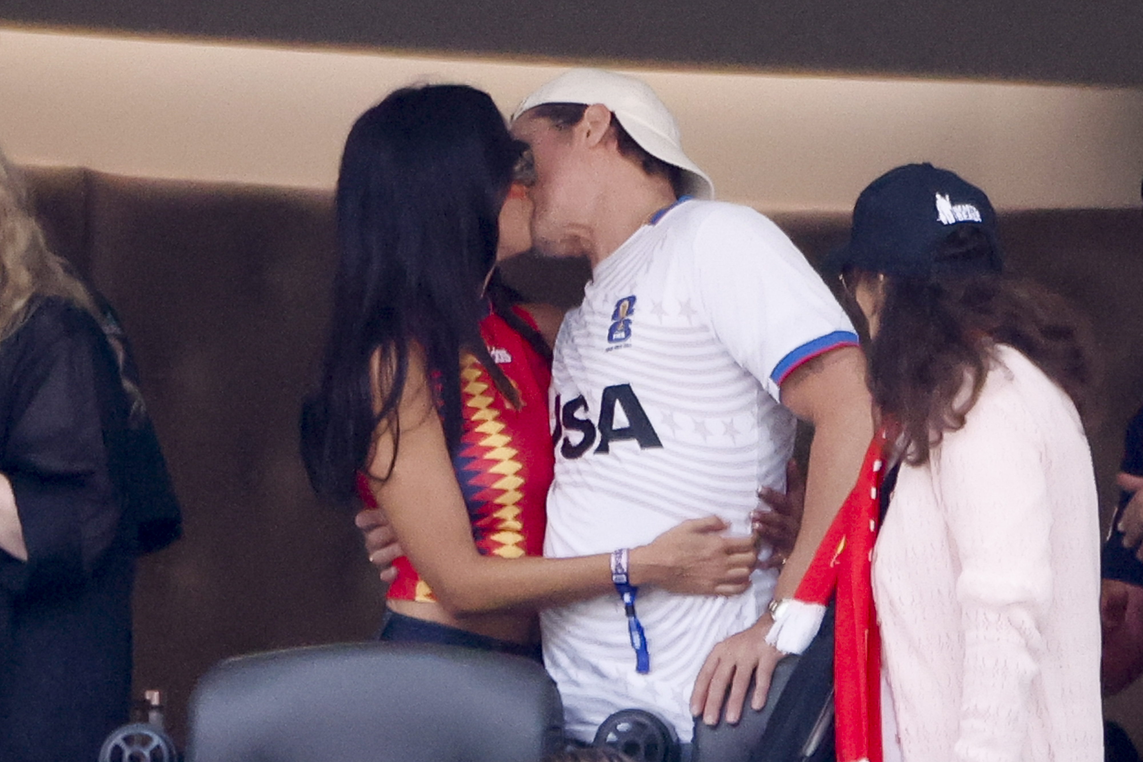 Brad Pitt and Ines de Ramon share a kiss while watching the Spain-Belgium quarterfinal at the 2026 FIFA World Cup in Inglewood, California, on July 10, 2026. | Source: Getty Images
