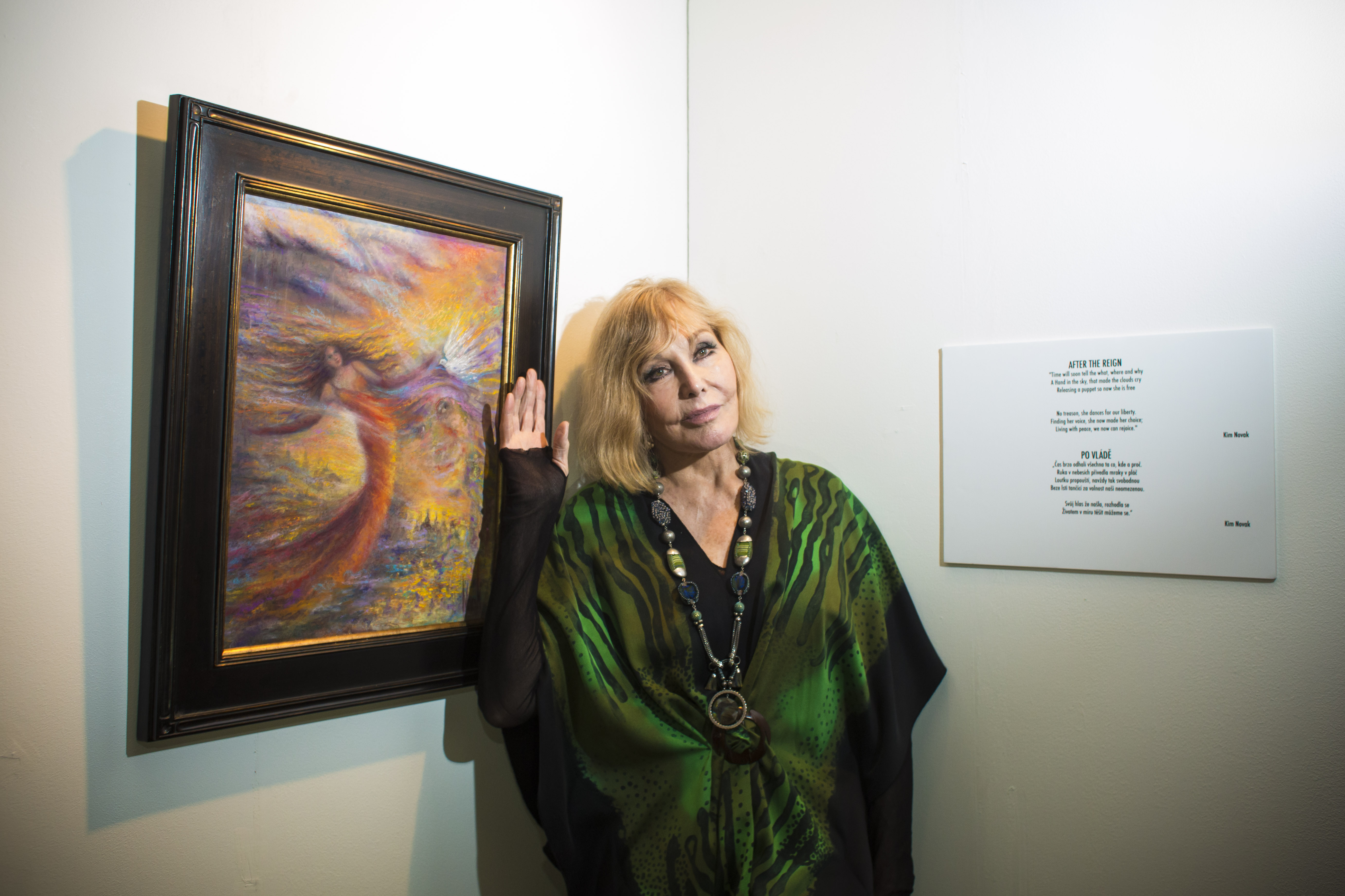 Kim Novak poses beside one of her paintings at a photocall during the Febiofest Prague International Film Festival in Prague, Czech Republic, on March 20, 2015. | Source: Getty Images